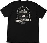 Black American-made T-shirt featuring a graphic of a factory, Texas outline, and text emphasizing quality and durability.