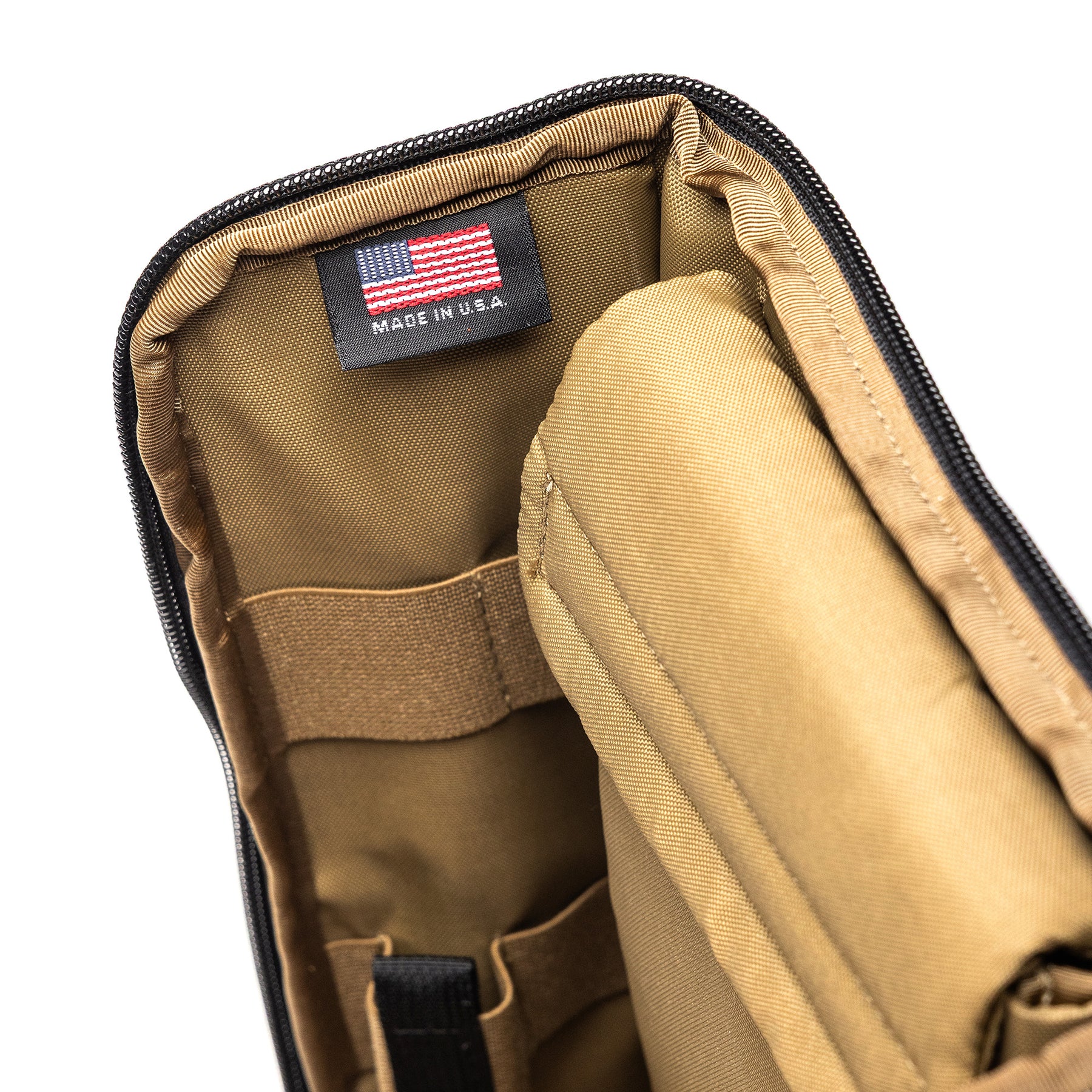 Inside view of the Lone Star 2 Pistol Bag with tan interior, multiple compartments, and a US-made label.