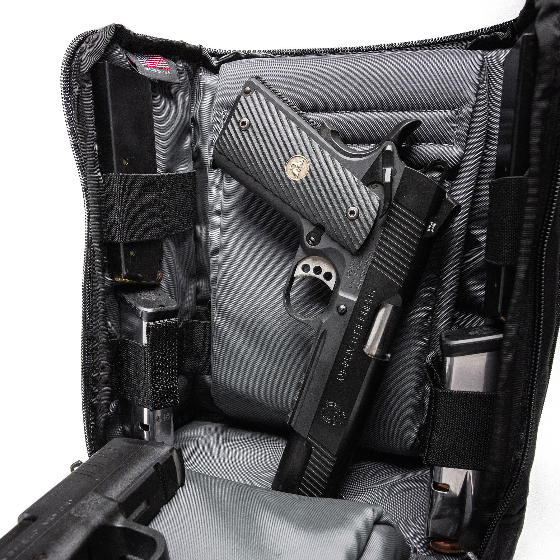 Inside the Lone Star 2 Pistol Bag, two handguns are securely stored with adjustable straps and padded compartments.
