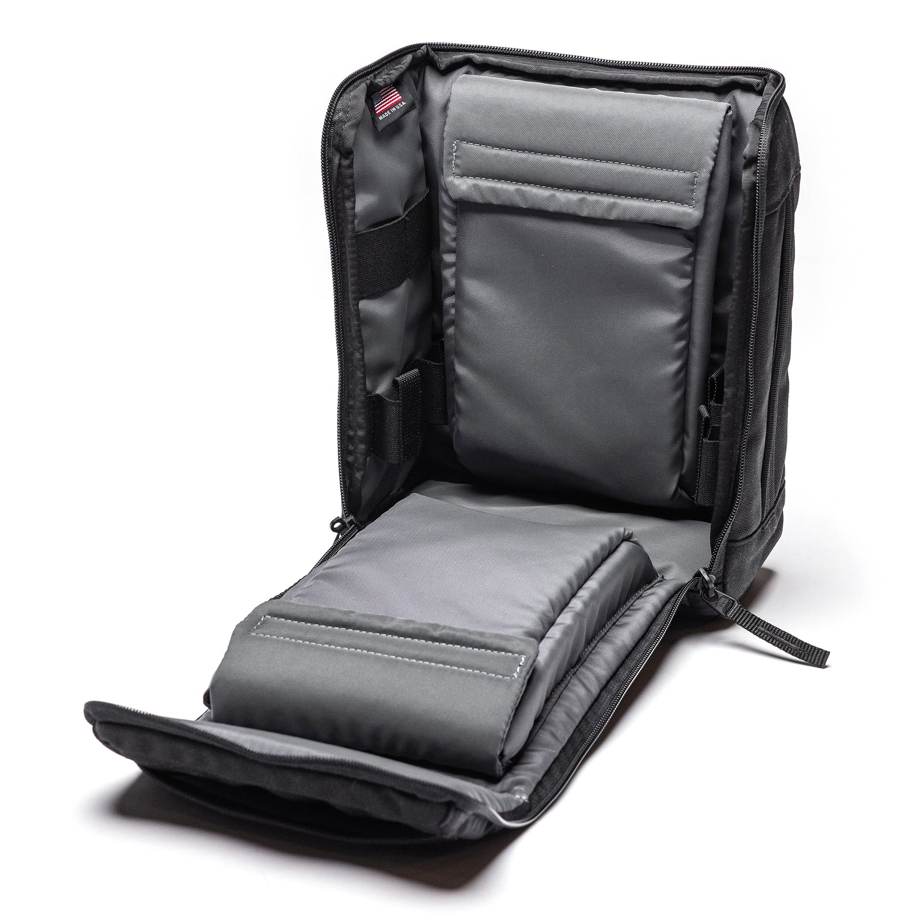 Open Lone Star 2 Pistol Bag with padded compartments and organizational pockets for carrying two pistols securely.