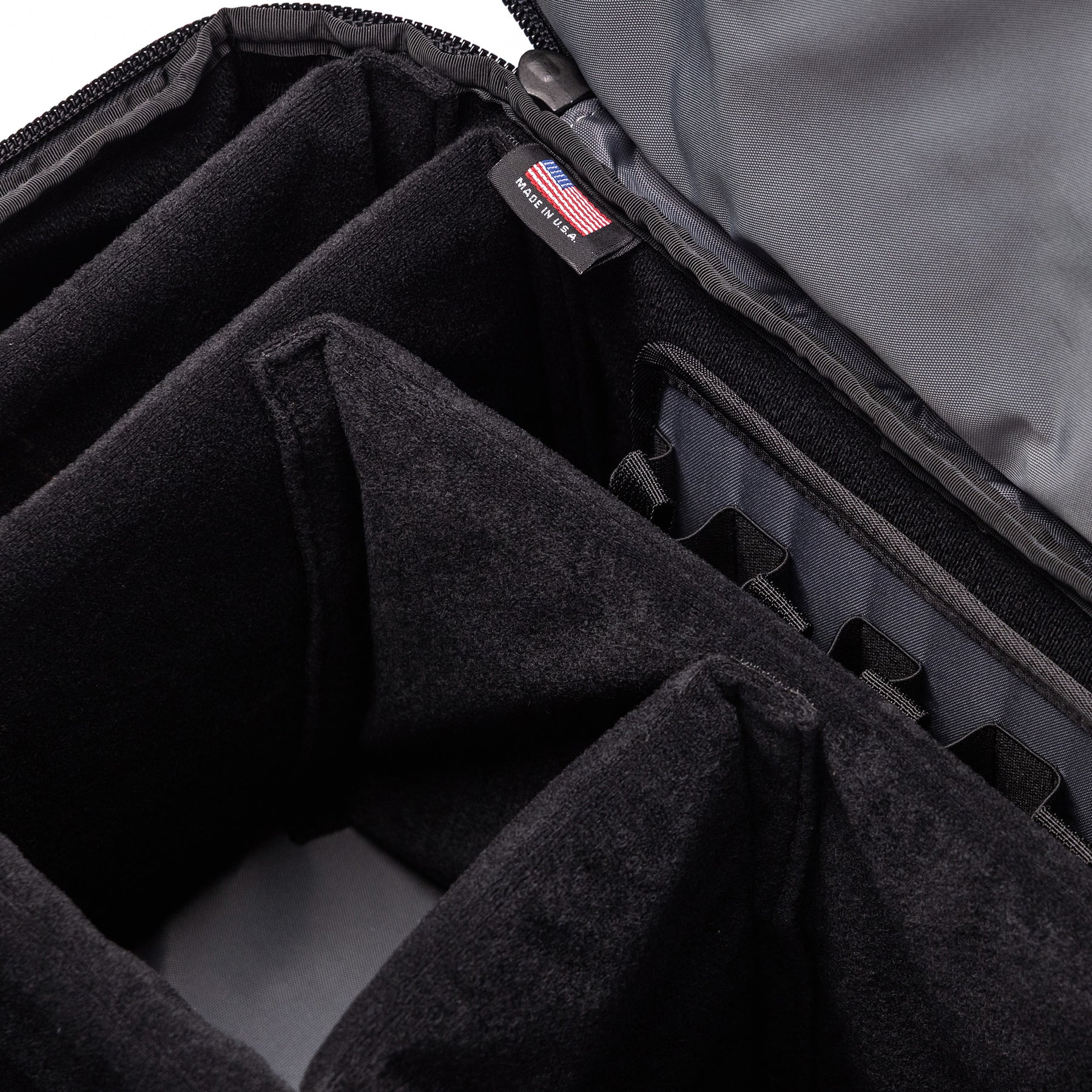 Interior view of the Lone Star Range Bag showing padded compartments for organized storage of firearms and accessories.