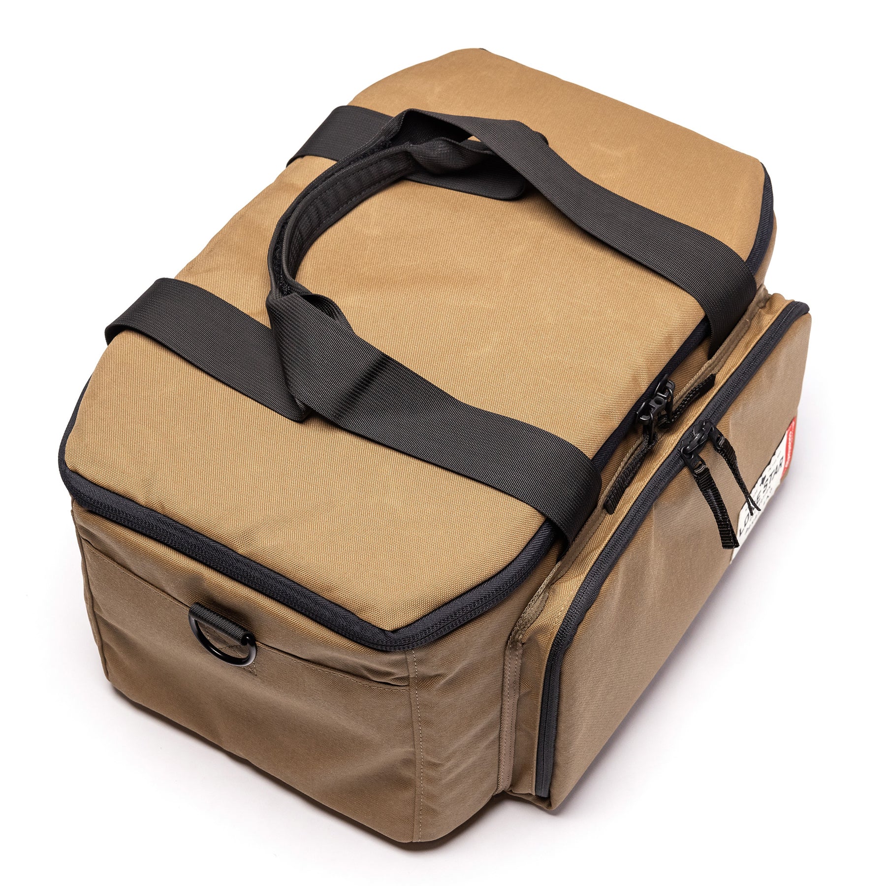 Lone Star Range Bag in tan with dual handles and side pocket, designed for secure storage and transport of gear.