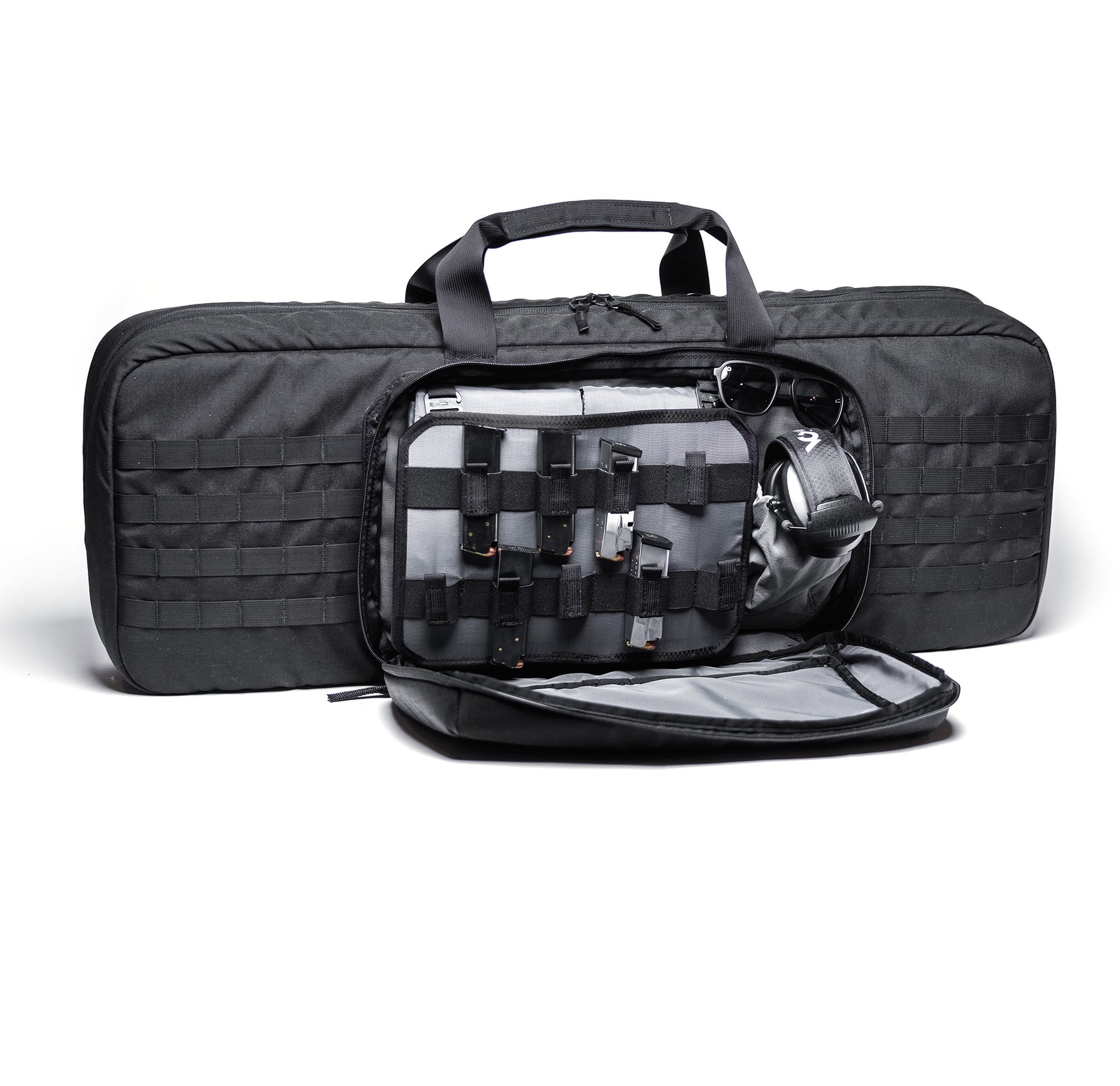 Black Lone Star 36" rifle bag with multiple compartments, MOLLE webbing, and accessories including sunglasses, ear protection, and magazines.