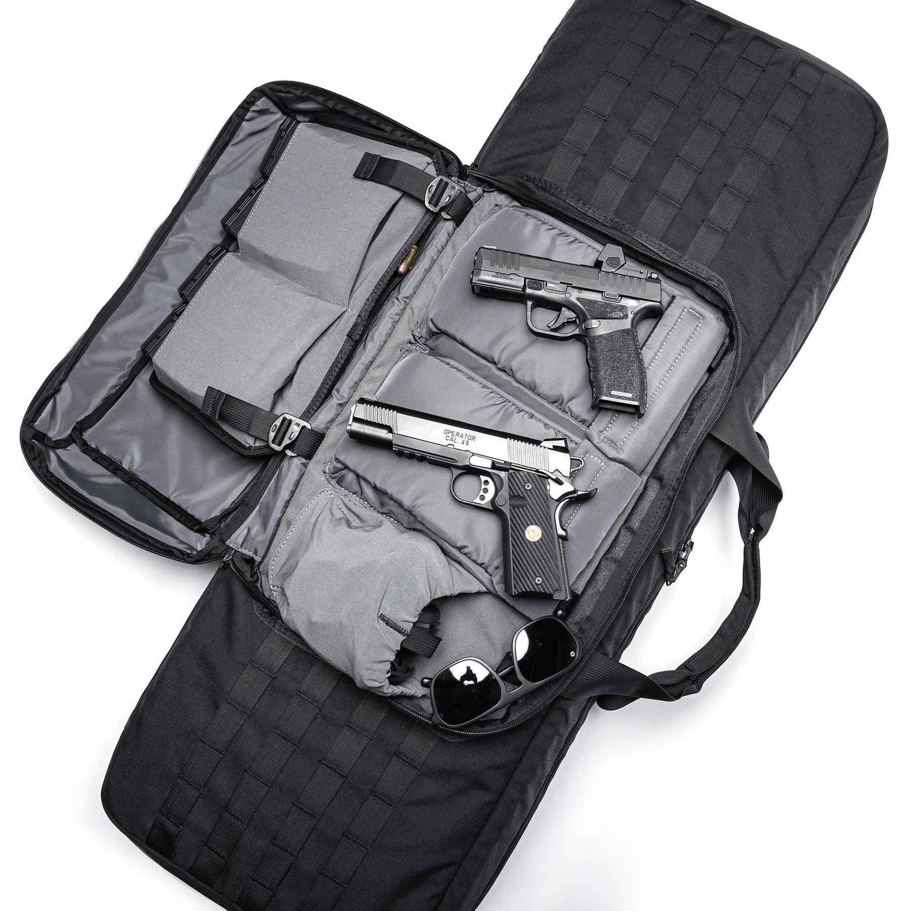 Open black Lone Star 36" rifle bag with padded compartments holding two handguns, sunglasses, and ammunition.