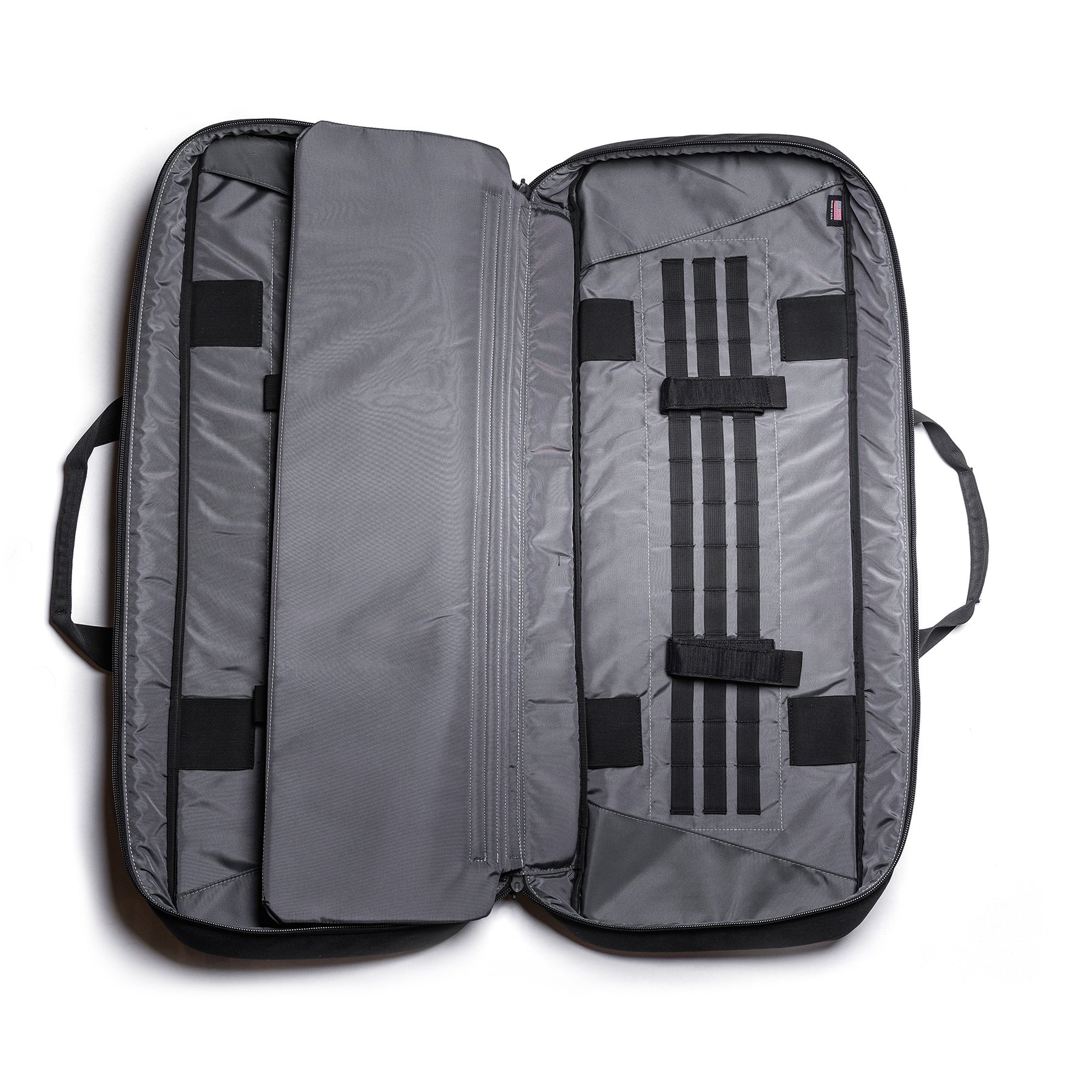 Open gray Lone Star 36" rifle bag with multiple compartments, straps, and padded interior for firearm storage.