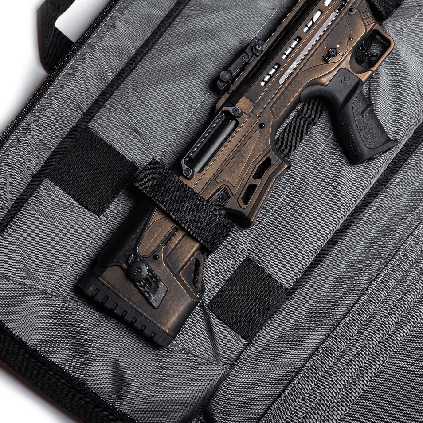 Gray Lone Star 36" rifle bag with adjustable straps, padded interior, and a firearm securely held inside.