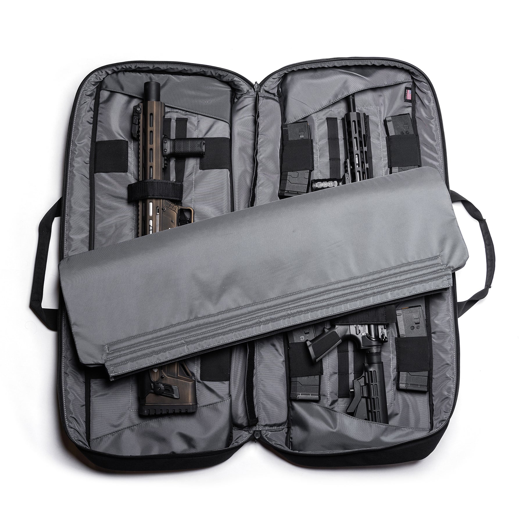 Open Lone Star 36" rifle bag with two rifles secured inside, padded compartments, and a removable cover for transport.
