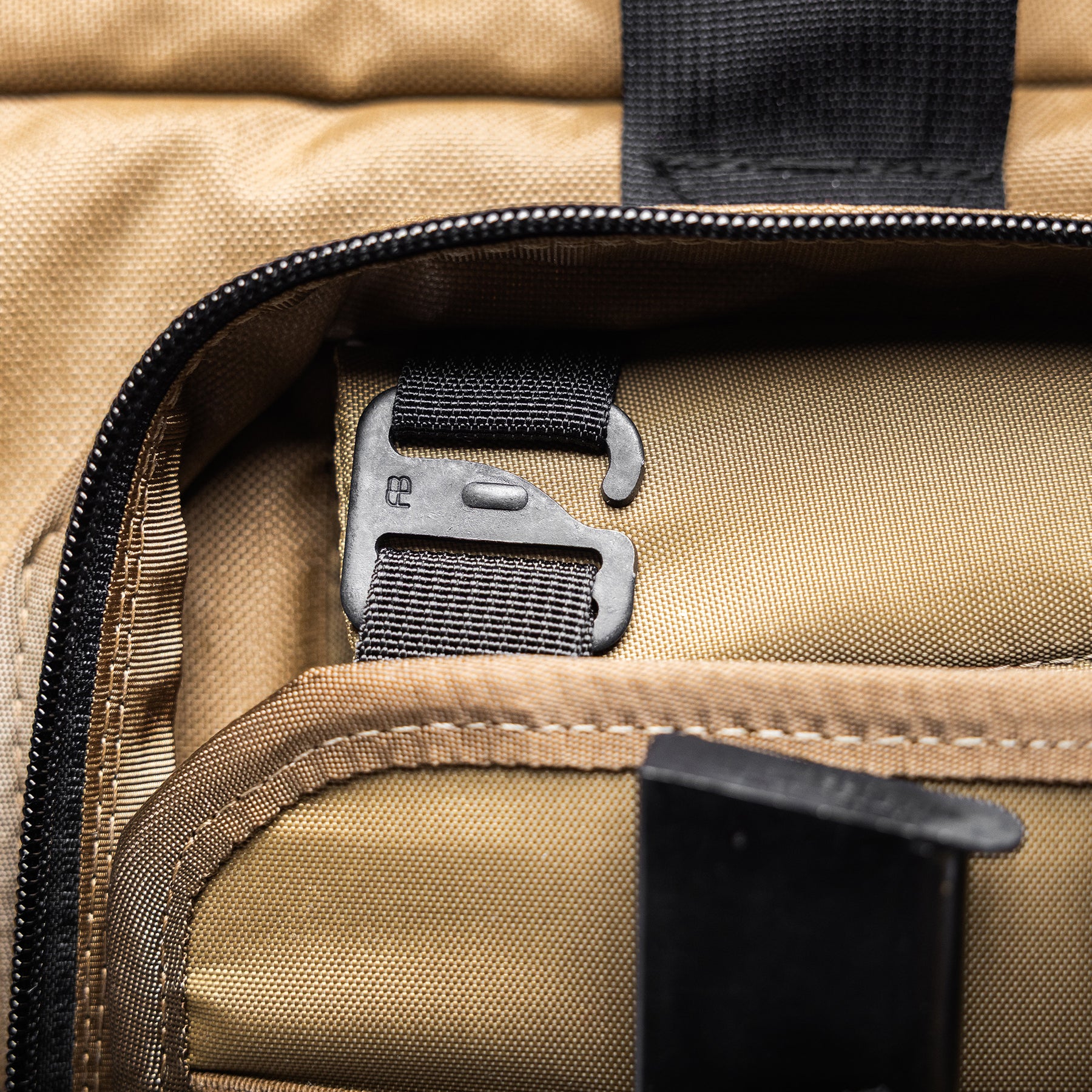 Close-up of a tan Lone Star 36" rifle bag with black zipper, strap, and metal clip for secure carrying.