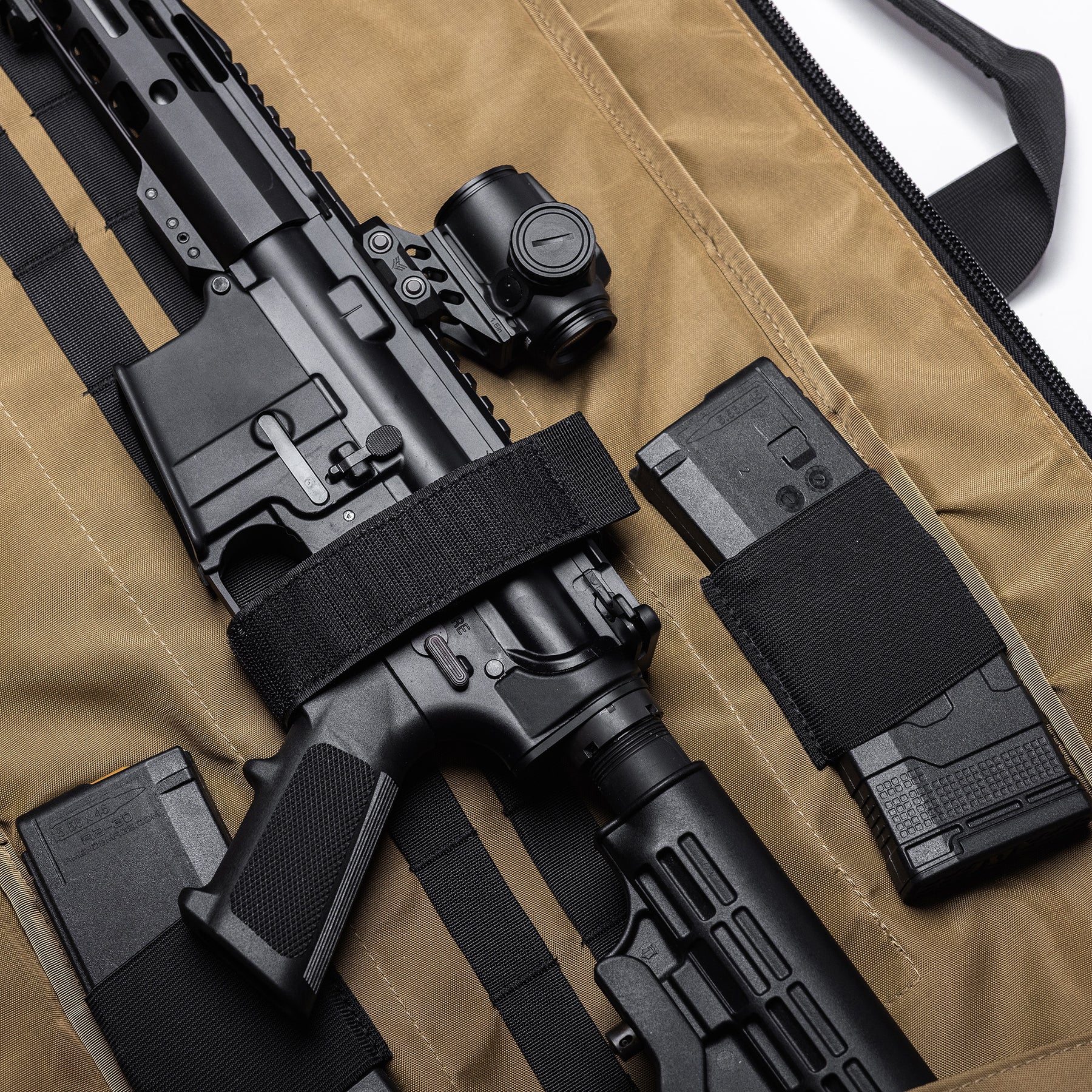 Lone Star 36" rifle bag with a black rifle, magazines, and accessories inside, padded interior, and secure straps.