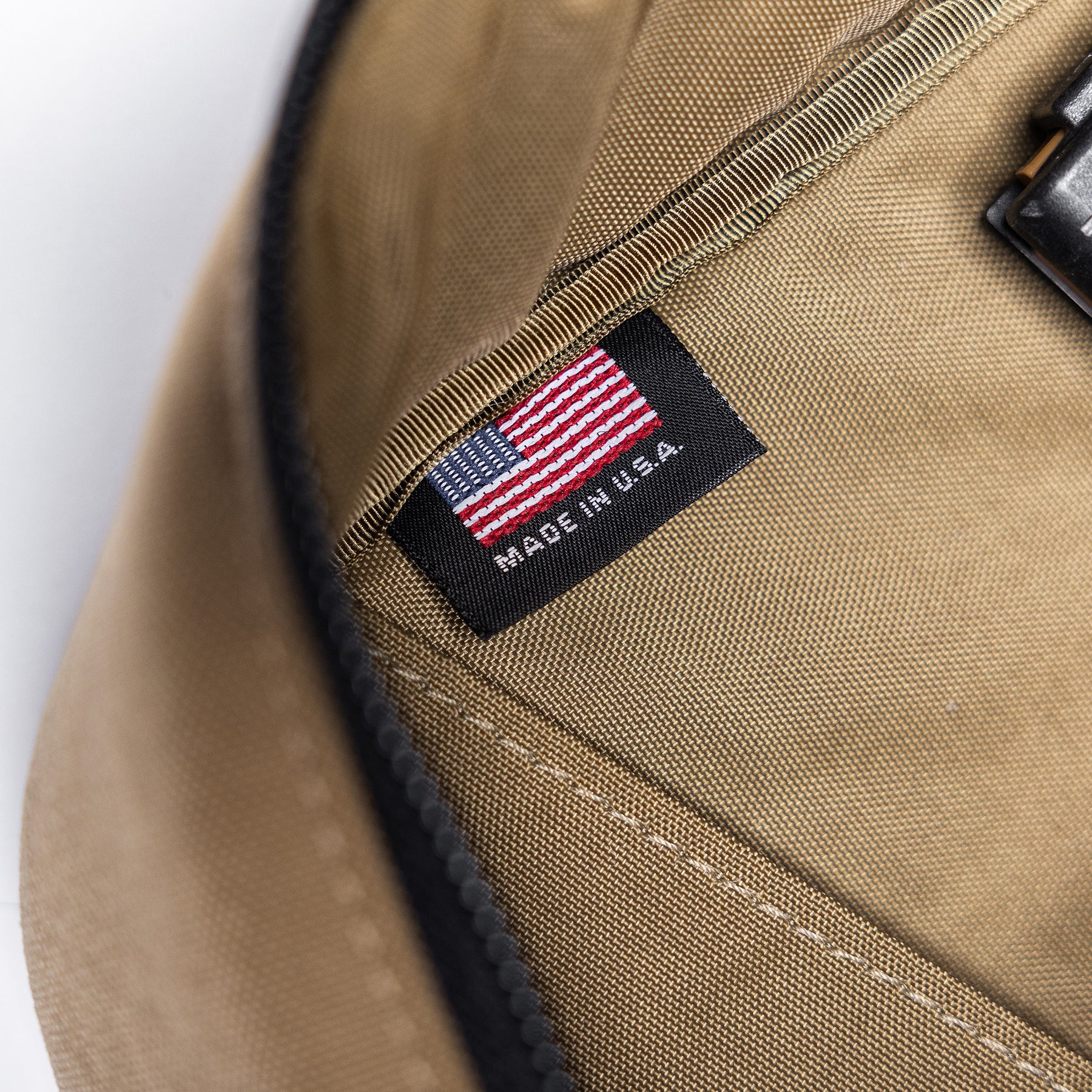Close-up of a tan Lone Star 36" rifle bag with a black label featuring an American flag and "Made in U.S.A." text.