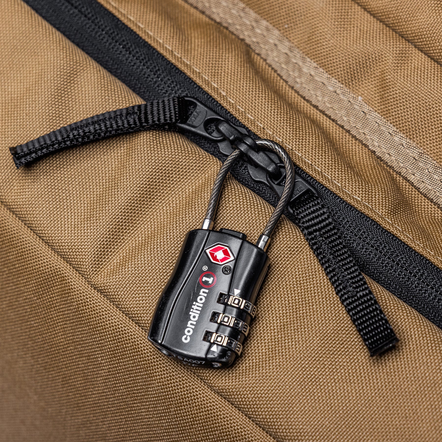 Brown Lone Star 36" rifle bag with a black combination lock securing a zipper.