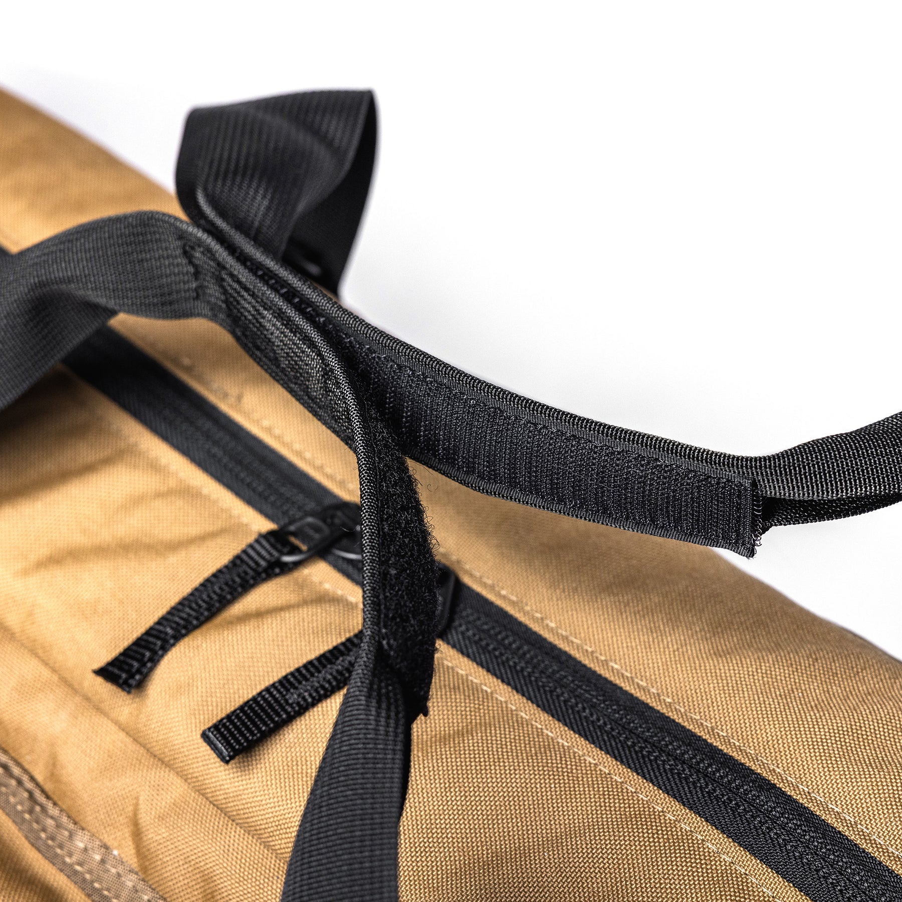 Close-up of a tan Lone Star 36" rifle bag with black zipper, handle, and strap details.