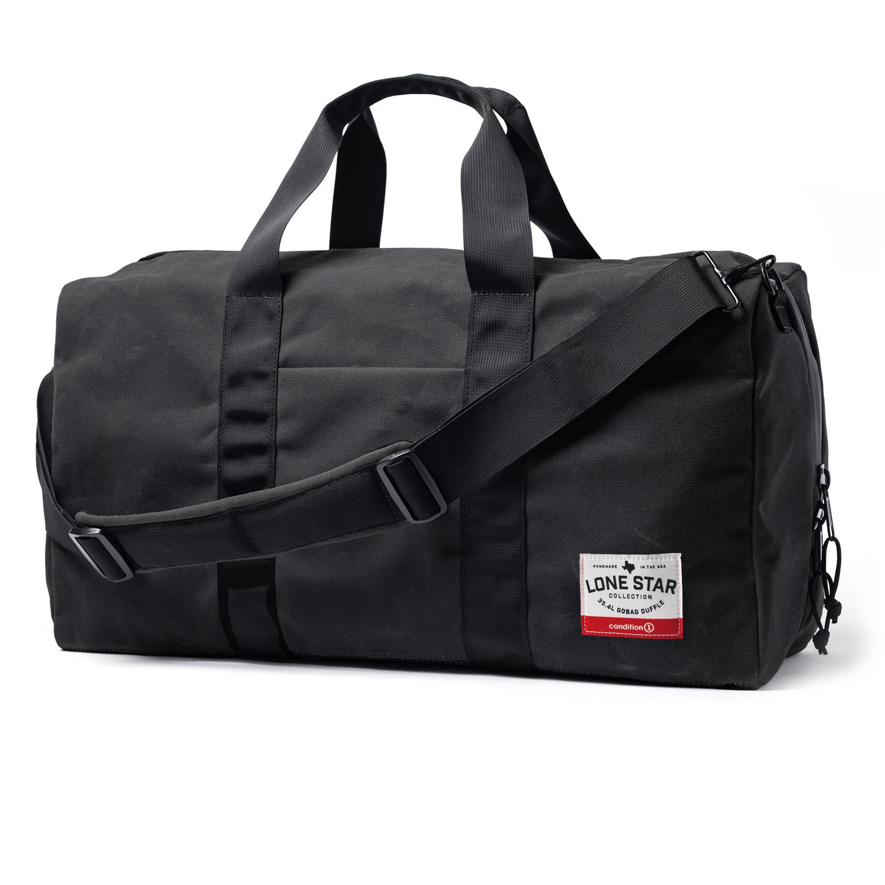 Black waxed canvas duffle bag with dual handles, adjustable shoulder strap, and a front patch label from the Lone Star Collection.