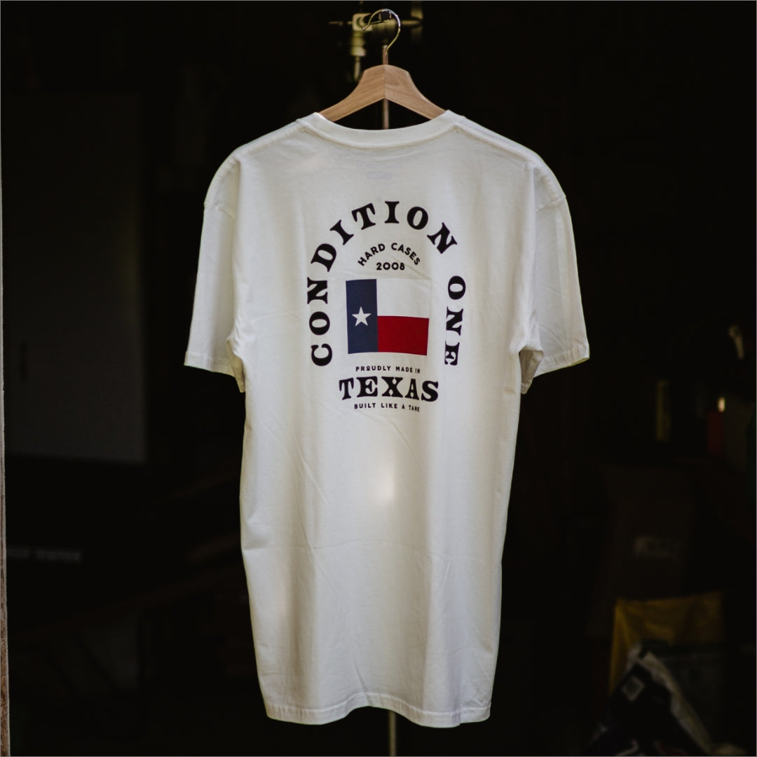 White "Like A Tank" T-shirt featuring Texas-themed graphics, bold text, and a star and flag design on the back.