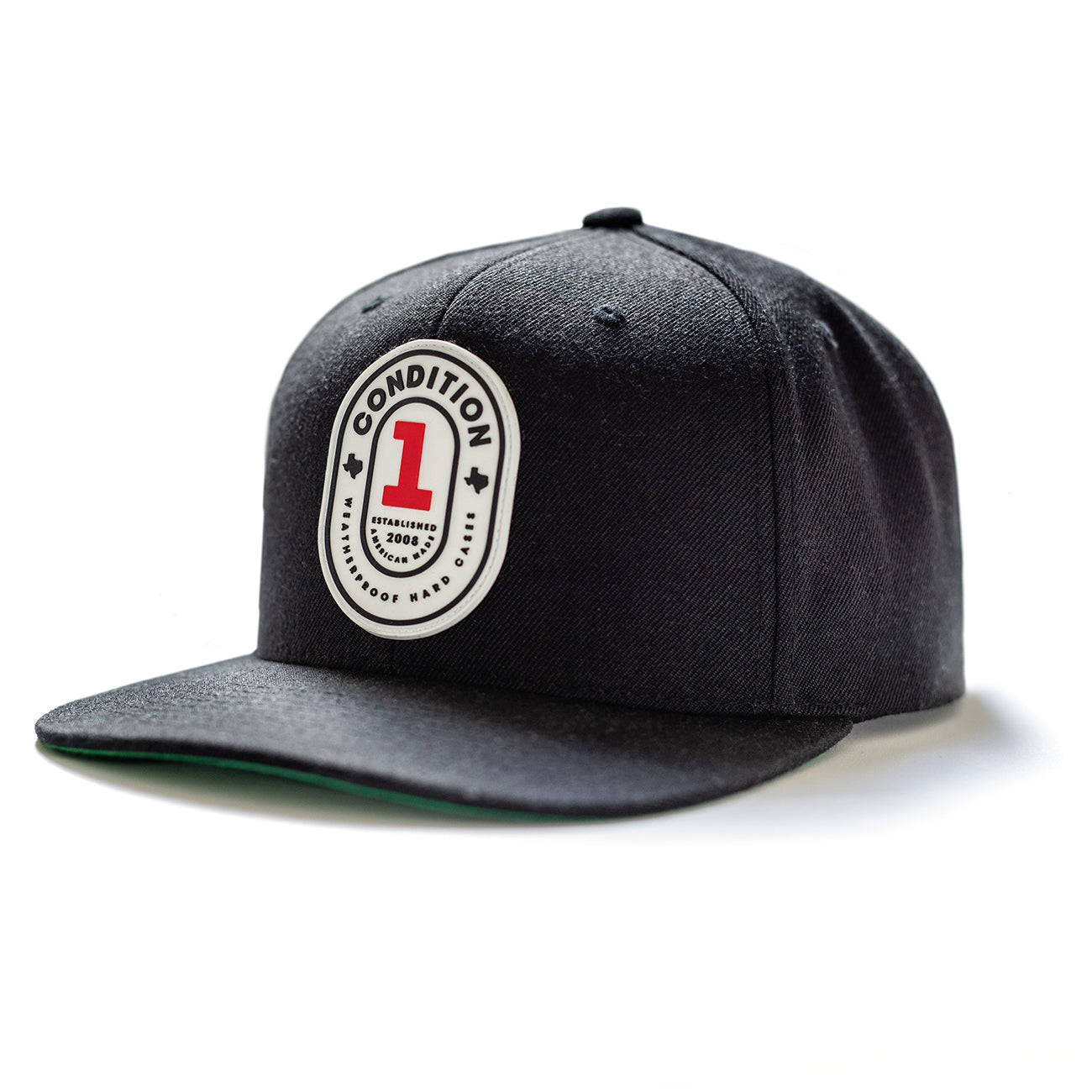 Black snapback cap with a white oval patch featuring red and black text, "The One," and a curved brim.