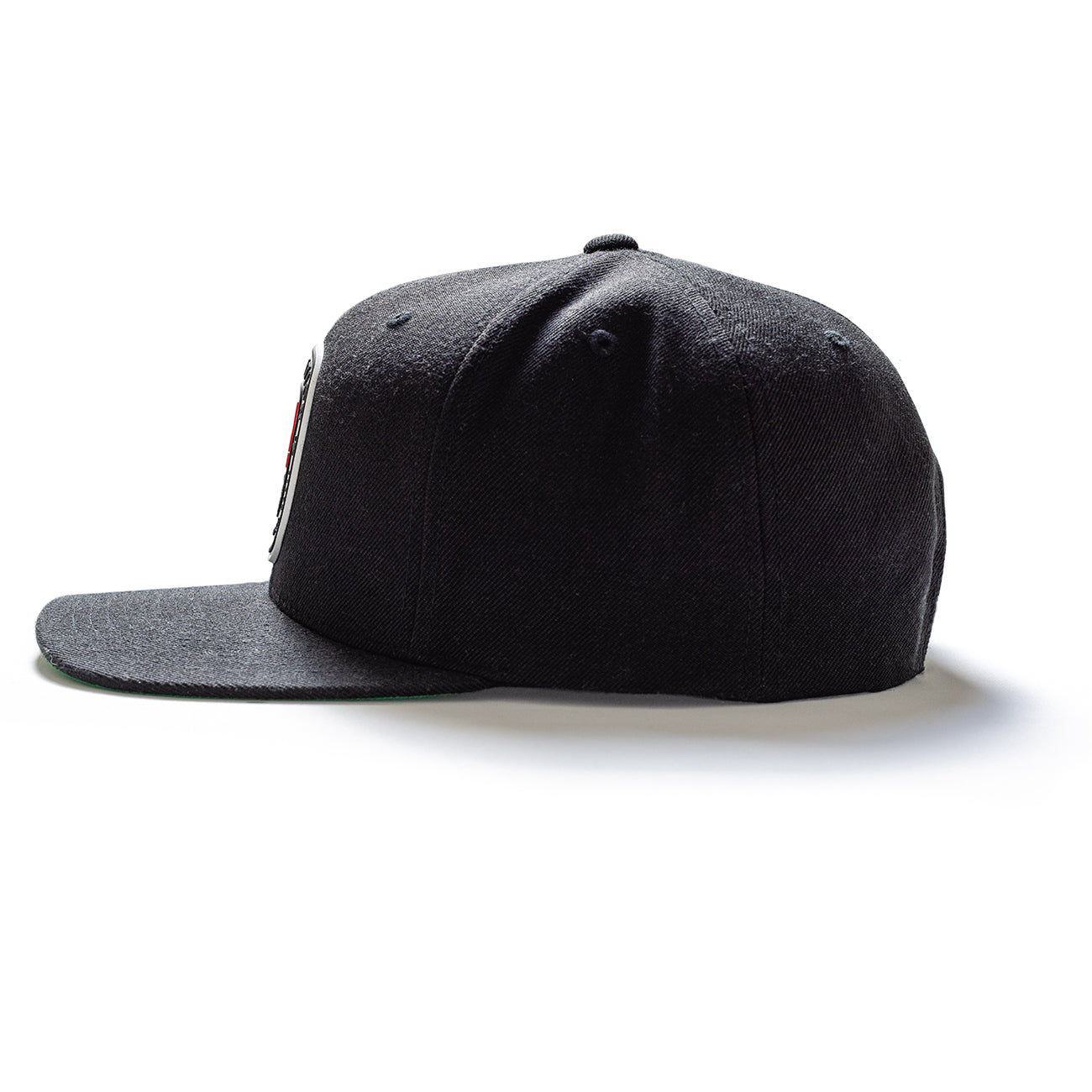 Black snapback cap with a flat brim and embroidered logo patch on the front, adjustable strap at the back.
