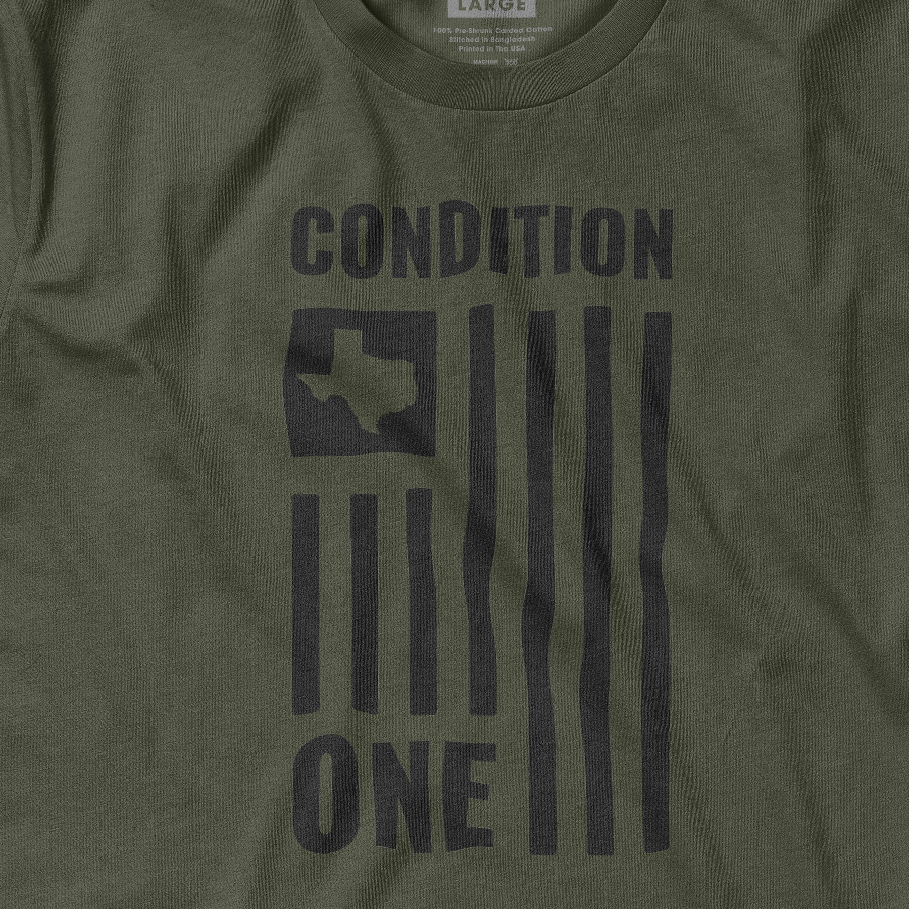 Green T-shirt with a black Texas map and the words "CONDITION ONE" printed vertically and horizontally.