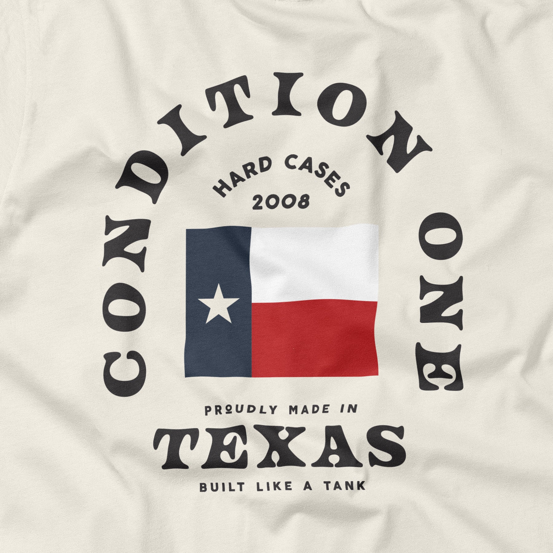 Like A Tank T-shirt featuring a Texas flag, circular text, and phrases "Proudly Made in Texas" and "Built Like a Tank.