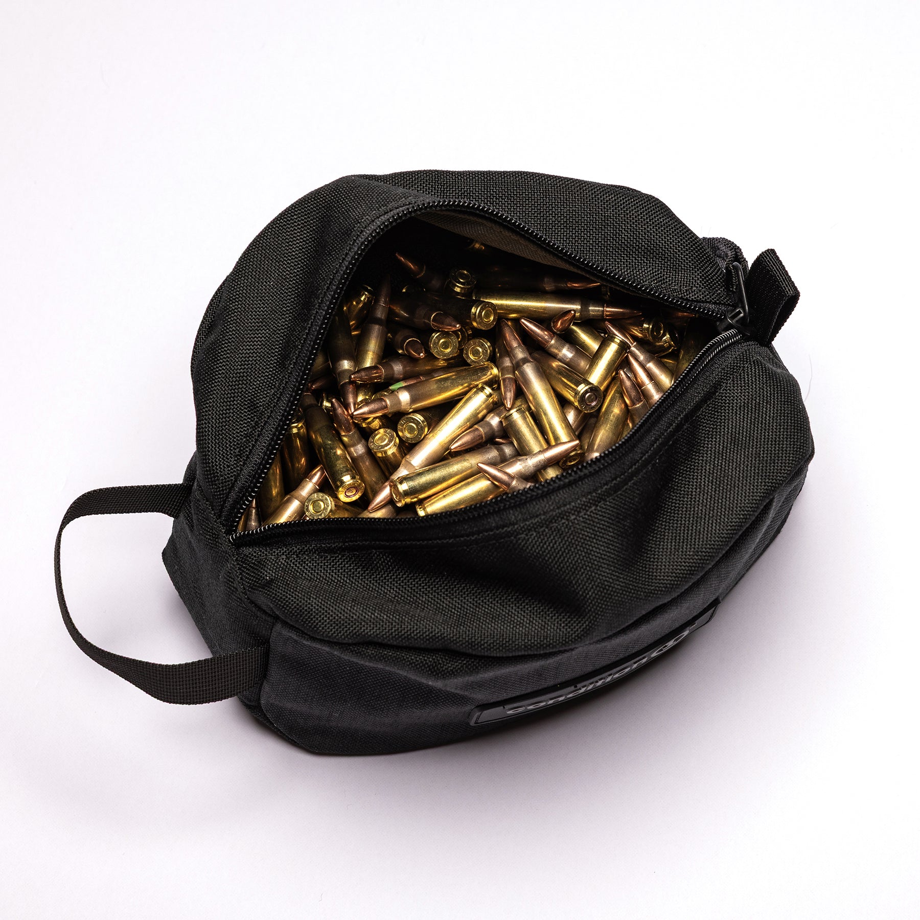 Lone Star Ammo Bag filled with various brass and copper ammunition casings, featuring a zippered opening and sturdy handle.