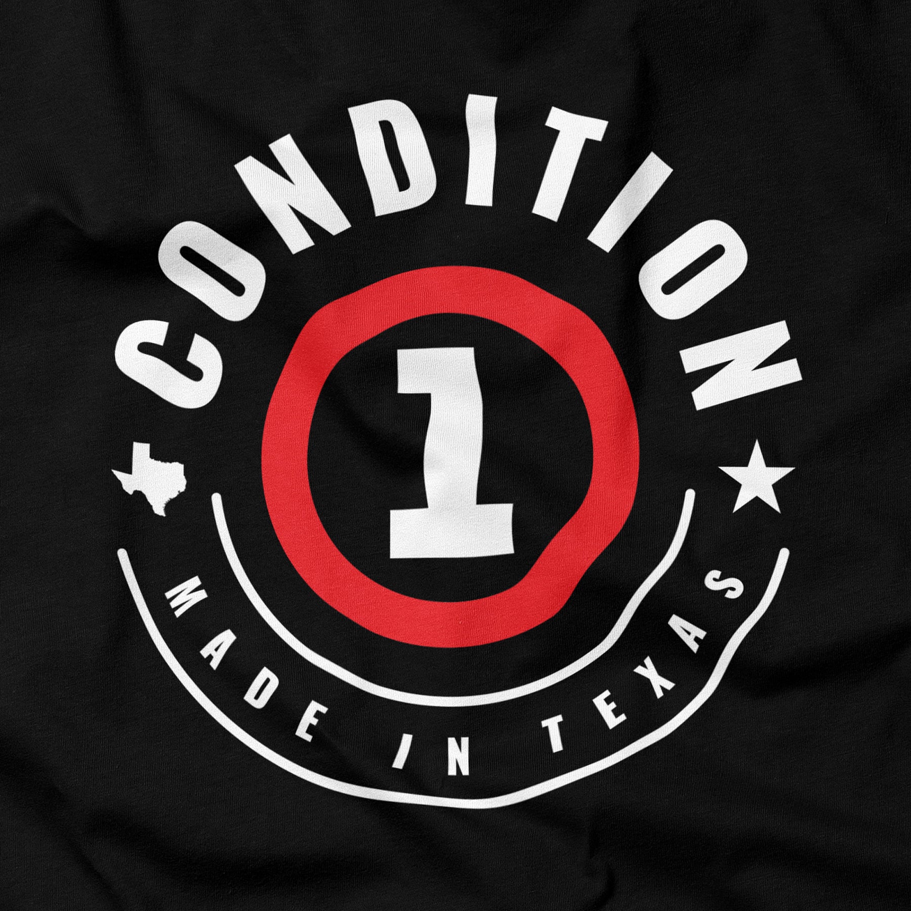 Black Texas-made T-shirt with a circular graphic design featuring "Conditon" and "Made in Texas" text, a star, and a large number 1.