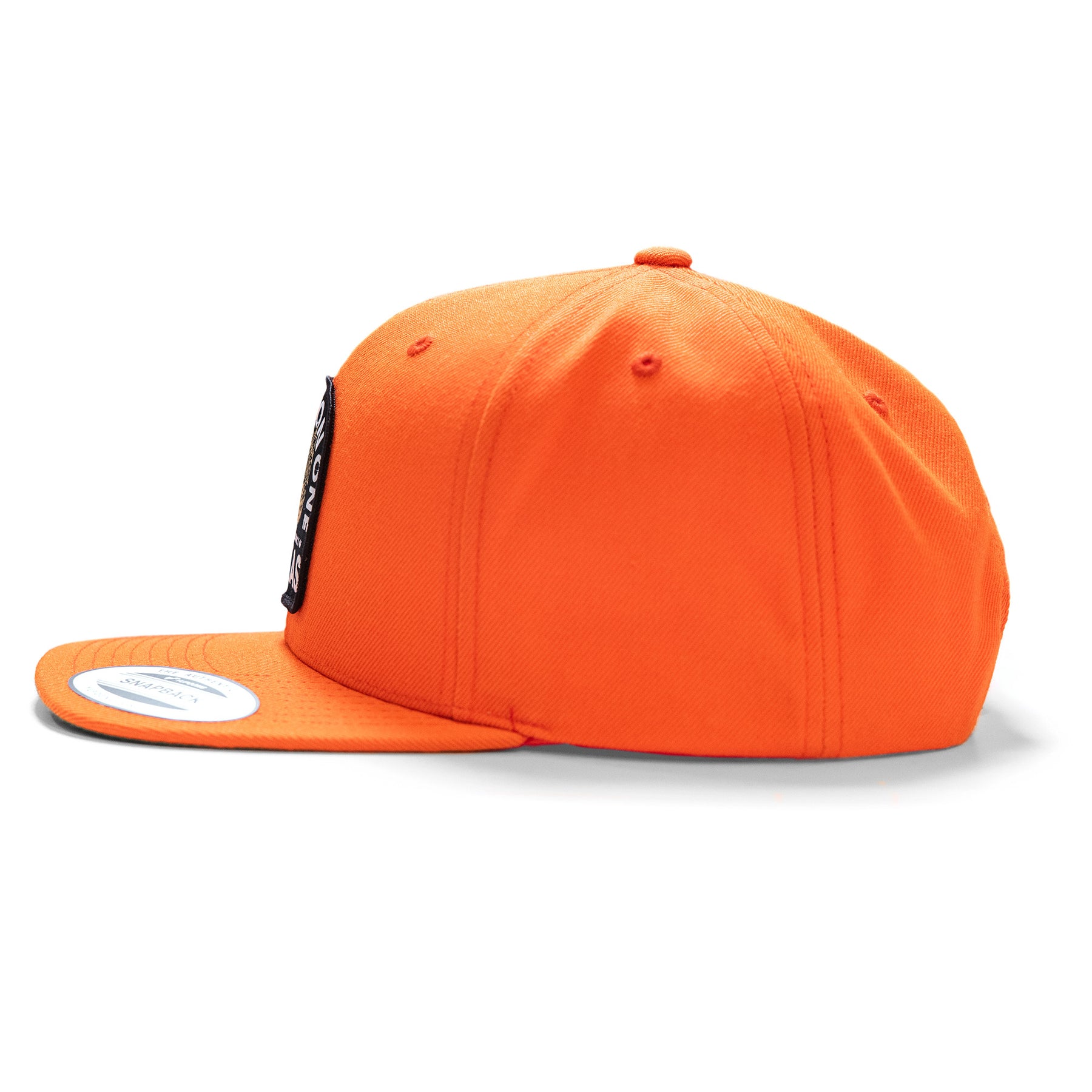 Orange snapback cap with "Texas Badass Hunter" embroidered patch, structured crown, and flat brim.