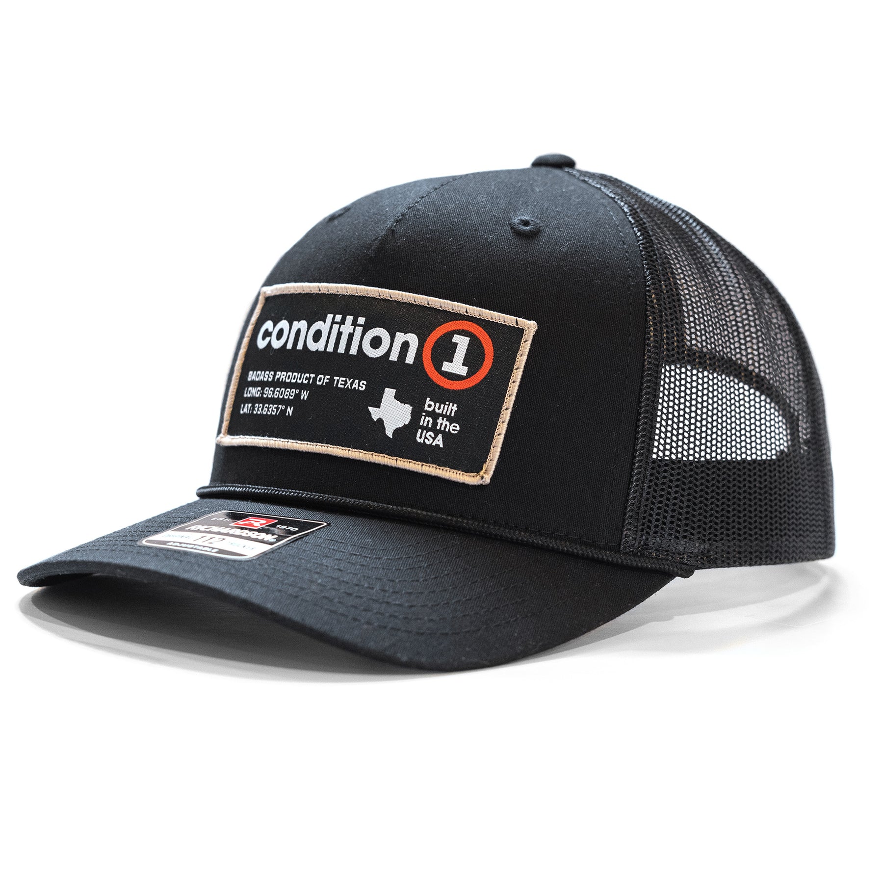 Black snapback hat with a patch reading "condition 1" and "built in the USA," featuring mesh back panels and a curved brim.