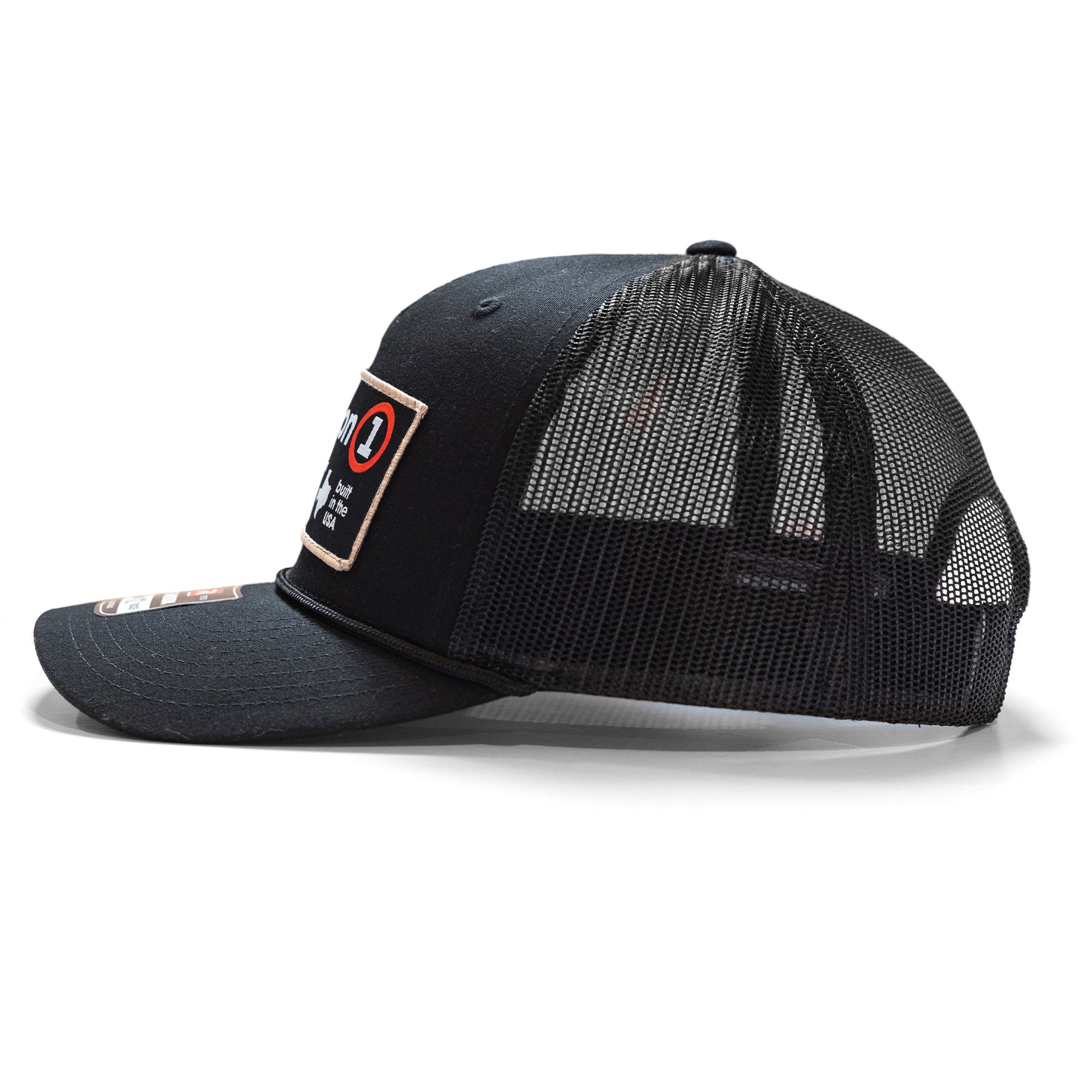 Black snapback hat with a mesh back, front patch, and curved brim, featuring a logo and text design.