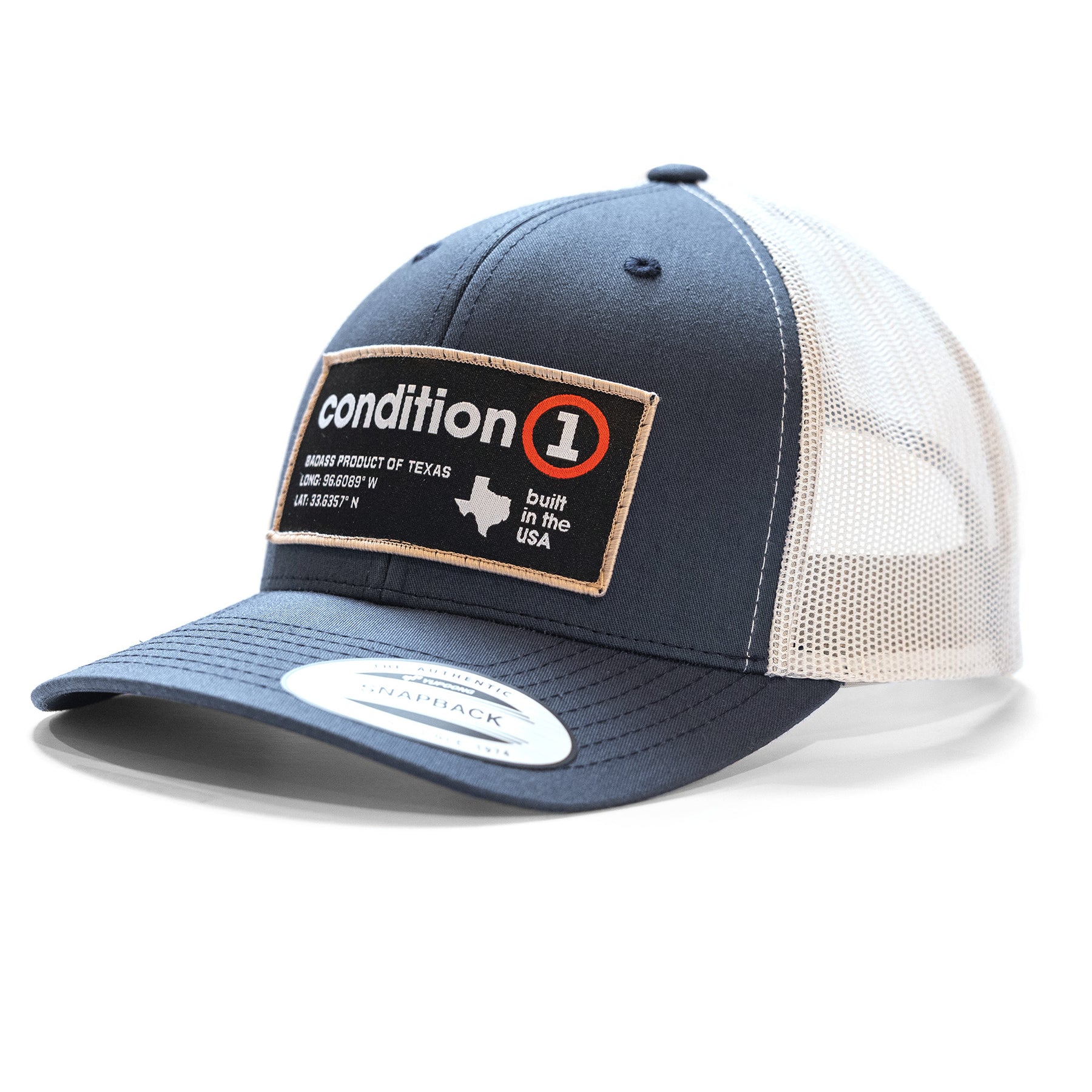 The Label - Snapback cap features a navy front, beige mesh back, and a patch with "condition 1" branding and Texas map.