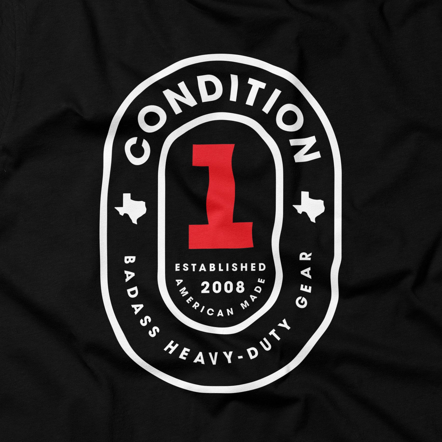 Black T-shirt featuring a bold white and red graphic design with the text "The One Tee," "Established 2008," and "Badass Heavy-Duty Gear.
