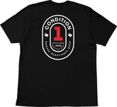 Back view of a black T-shirt featuring a large circular logo with "The One Tee" design, including "Condition 1," "Badass Heavy-Duty Gear," and "Established 2008.