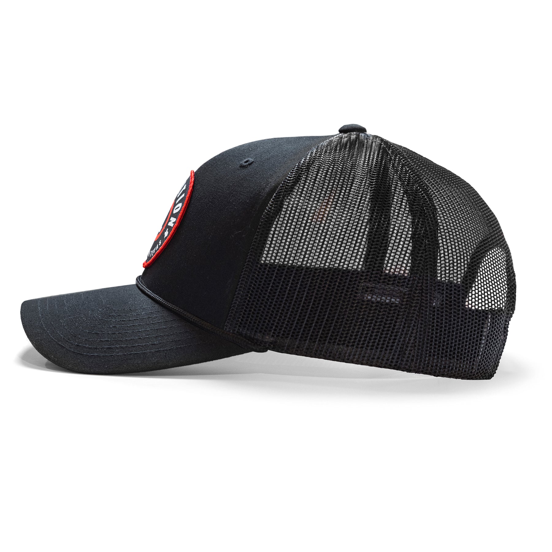 Black snapback cap with a mesh back and a circular logo patch on the front, featuring a curved brim and adjustable strap.