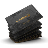 Stack of black and gold Condition 1 gift cards featuring a rugged design and the Condition 1 logo in gold lettering.