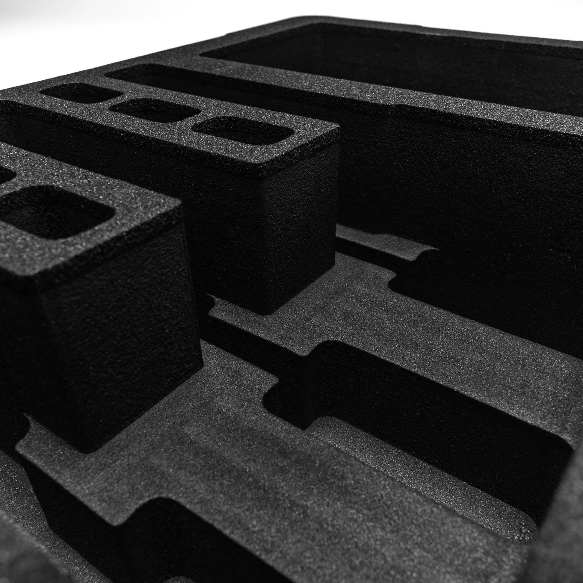 Pre-cut foam insert for #179 case featuring three slots and six magazine compartments for secure storage and protection.