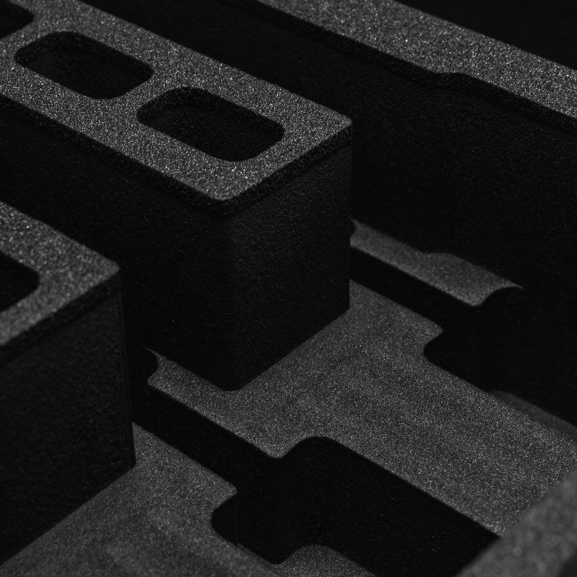Pre-cut foam insert for #179 case featuring three slots for magazines, designed for secure storage and protection.