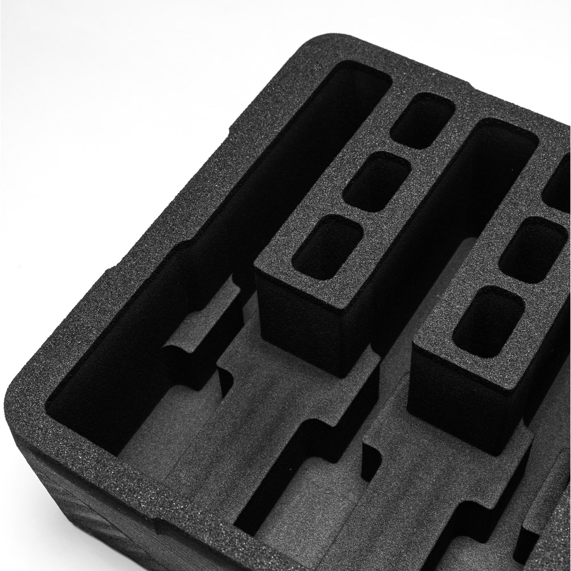 Pre-cut foam insert for #179 case, featuring three slots and six magazine compartments for secure storage.