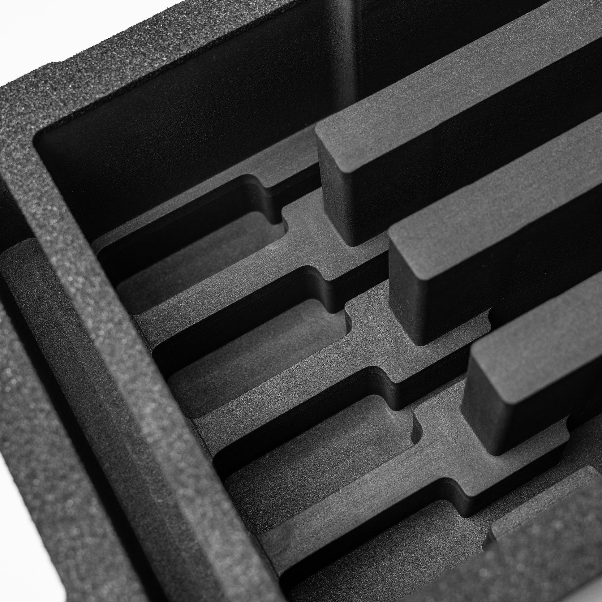 Pre-cut foam insert for #300 case featuring four slots designed to securely hold eight magazines during transport.