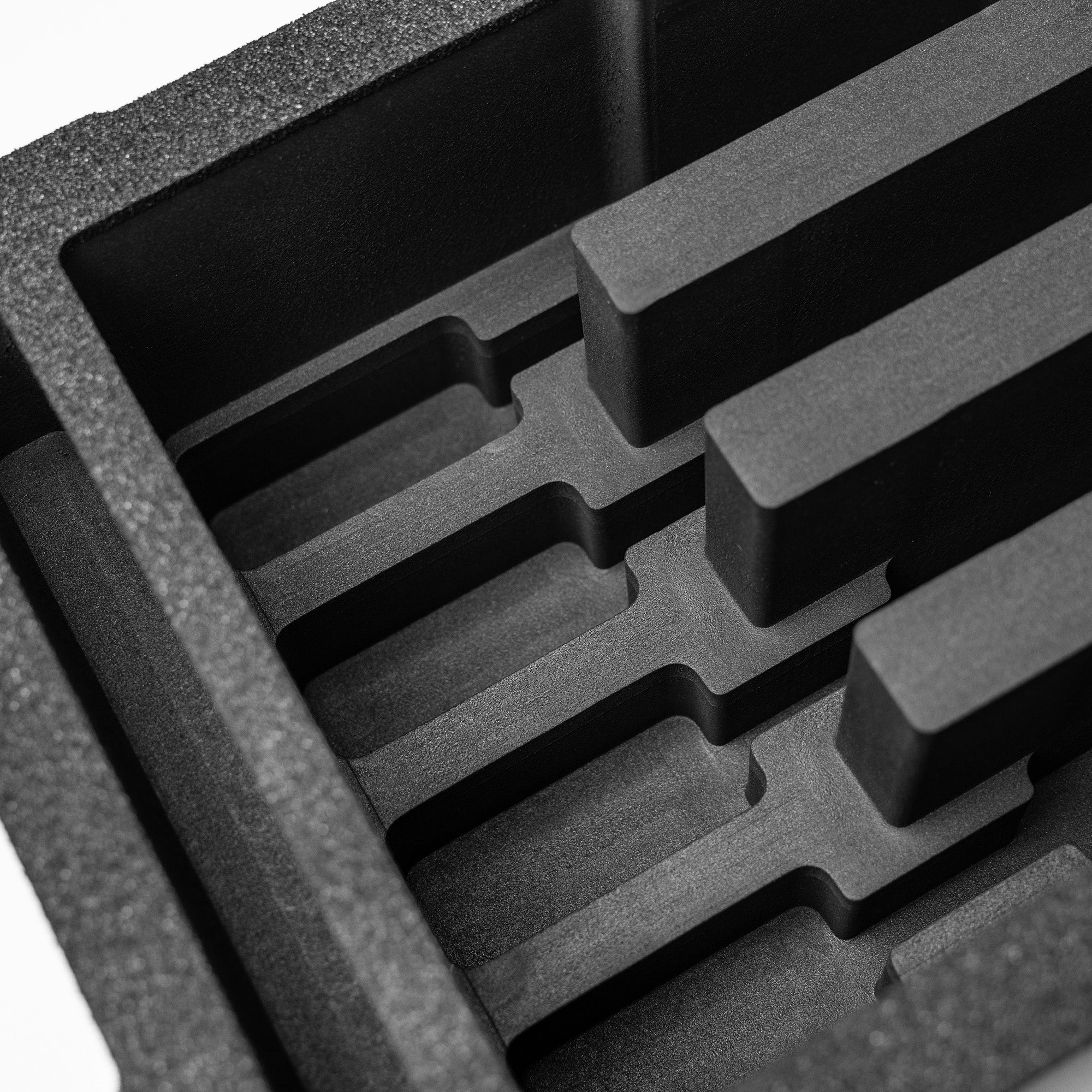 Pre-cut foam insert for #300 case featuring four slots designed to securely hold eight magazines during transport.