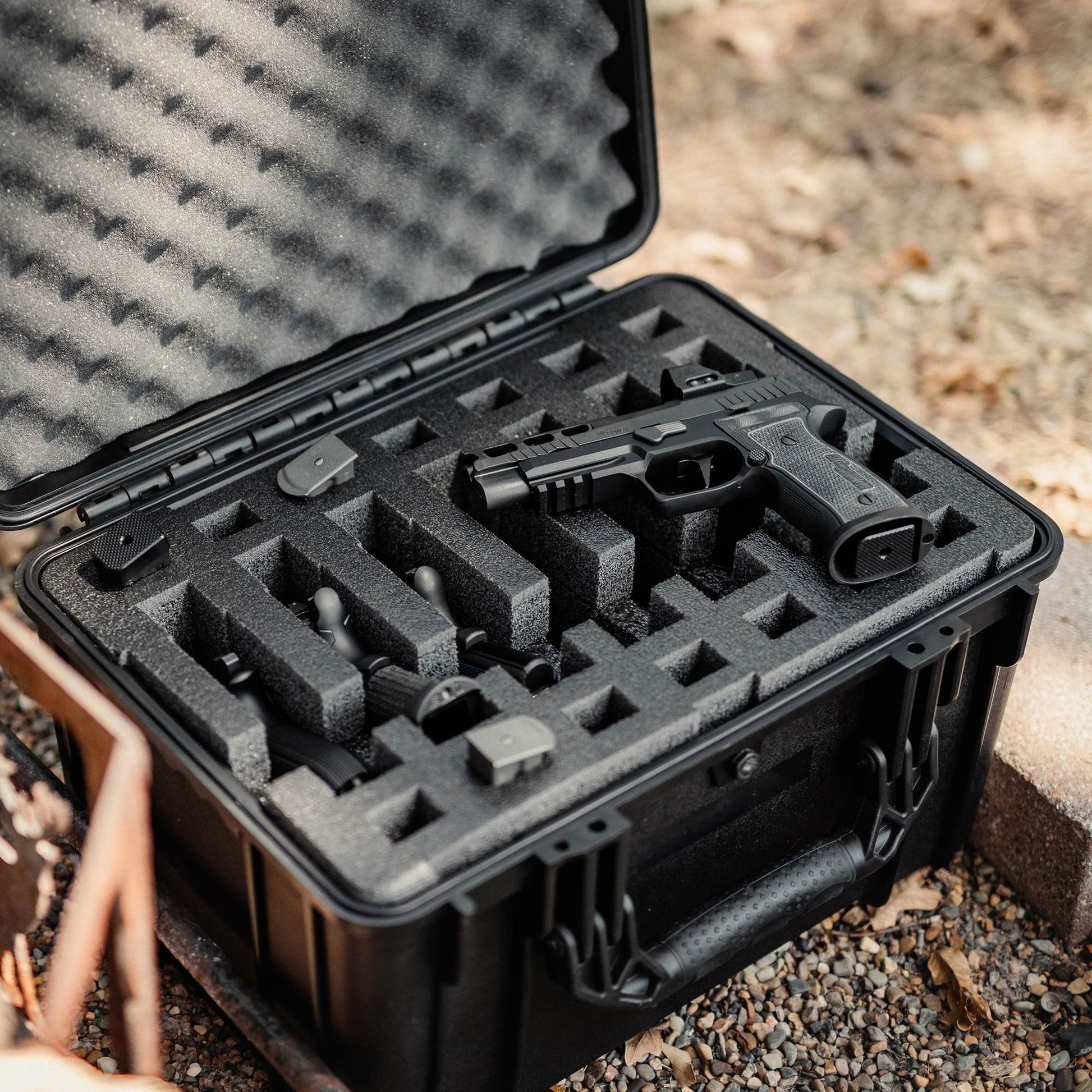 Pre-cut foam insert for #997 case, featuring 7 slots for magazines and space for a pistol, ensuring secure storage.