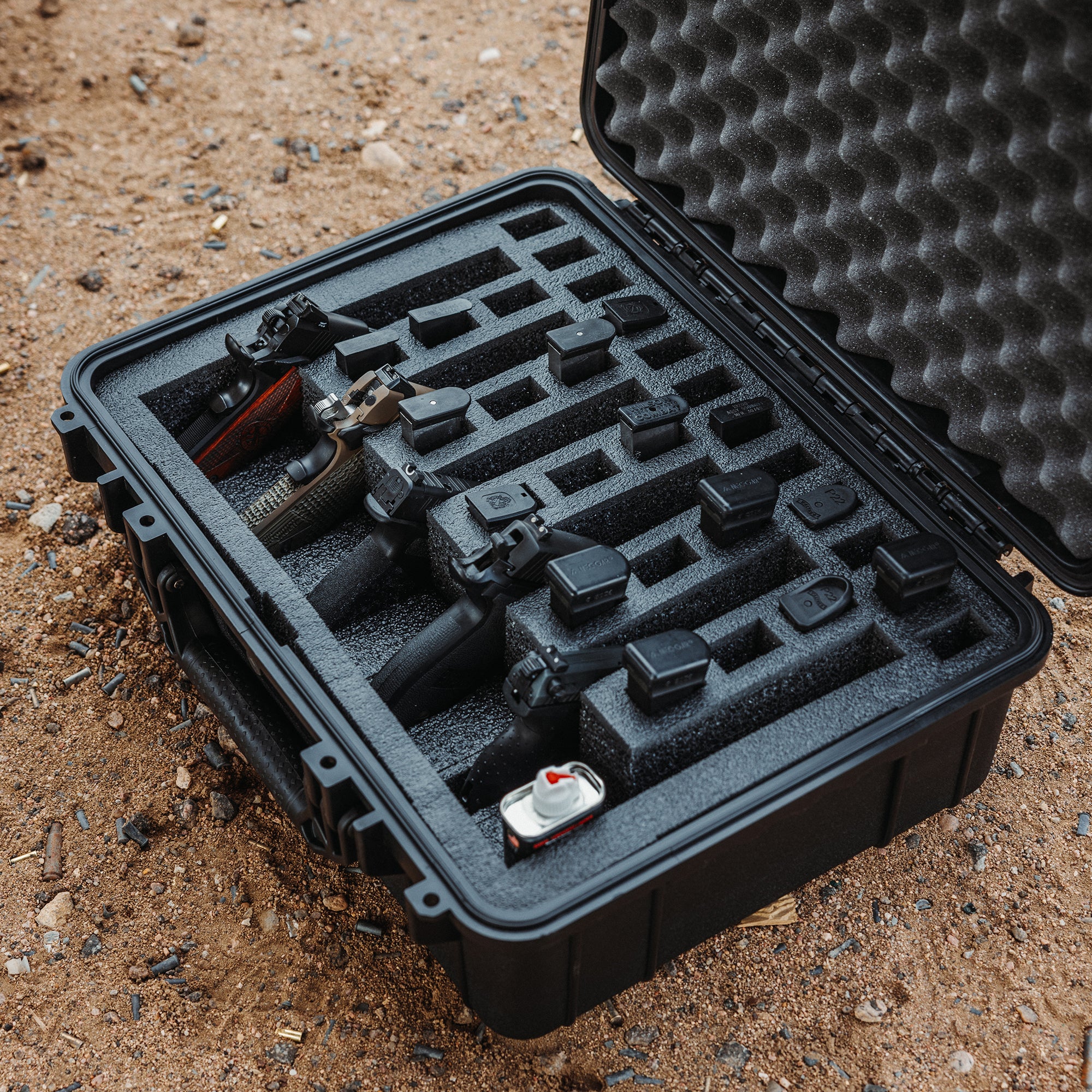 Foam insert with six slots for 27 magazines, designed for #227 case, shown with pistols and accessories inside.