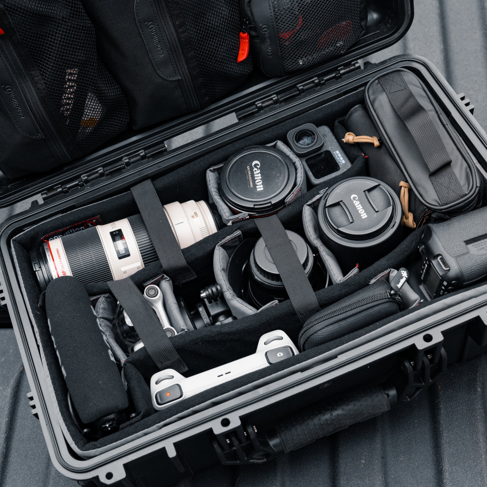 Padded divider set for #300 case, organizing camera lenses and accessories securely inside a protective hard case.