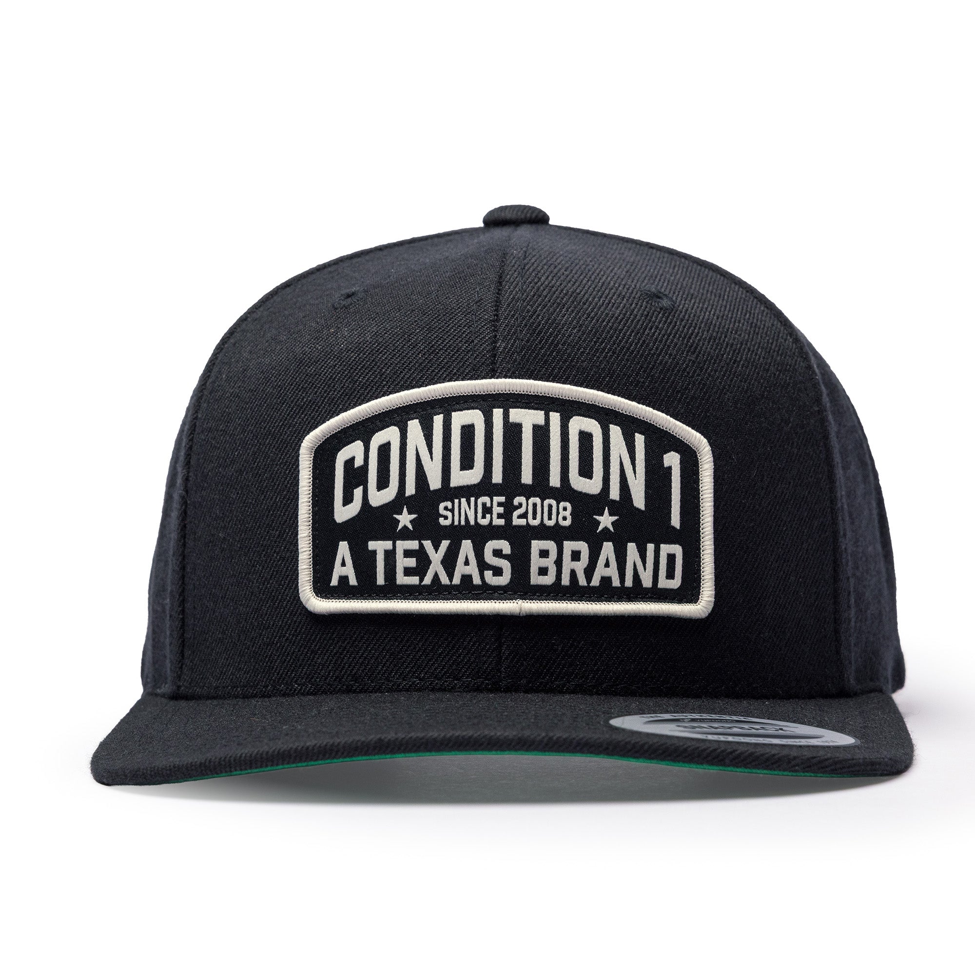Black snapback hat featuring a prominent embroidered patch that reads "Condition 1 Since 2008 A Texas Brand.