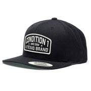 Black Texas Brand snapback hat featuring a white embroidered patch with "Condition 1 Since 2008" on the front.