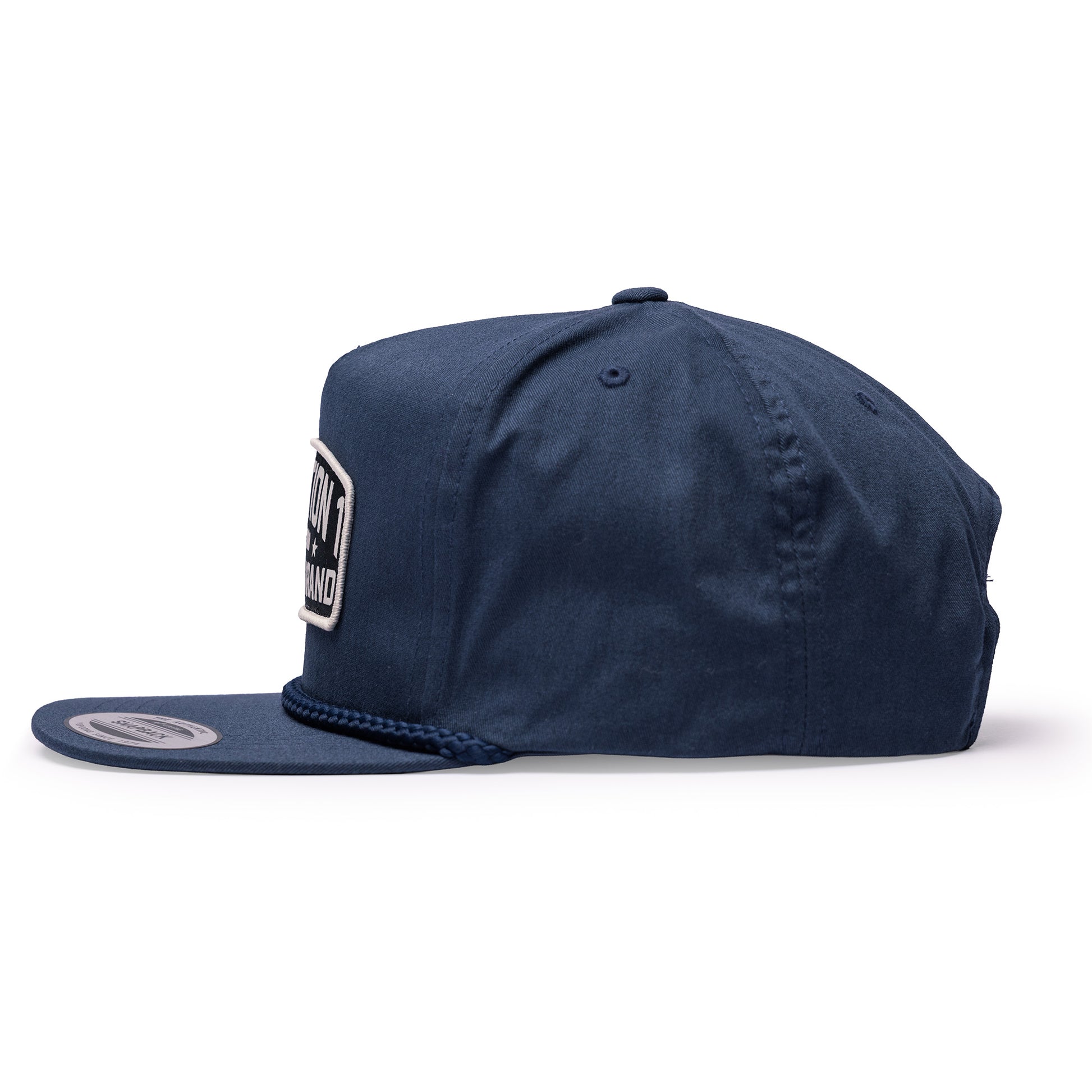 Navy unstructured snapback cap featuring a Texas Brand logo patch on the front and a braided detail on the brim.