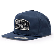 Navy unstructured snapback cap featuring a prominent patch with "Condition 1" and "A Texas Brand" text.
