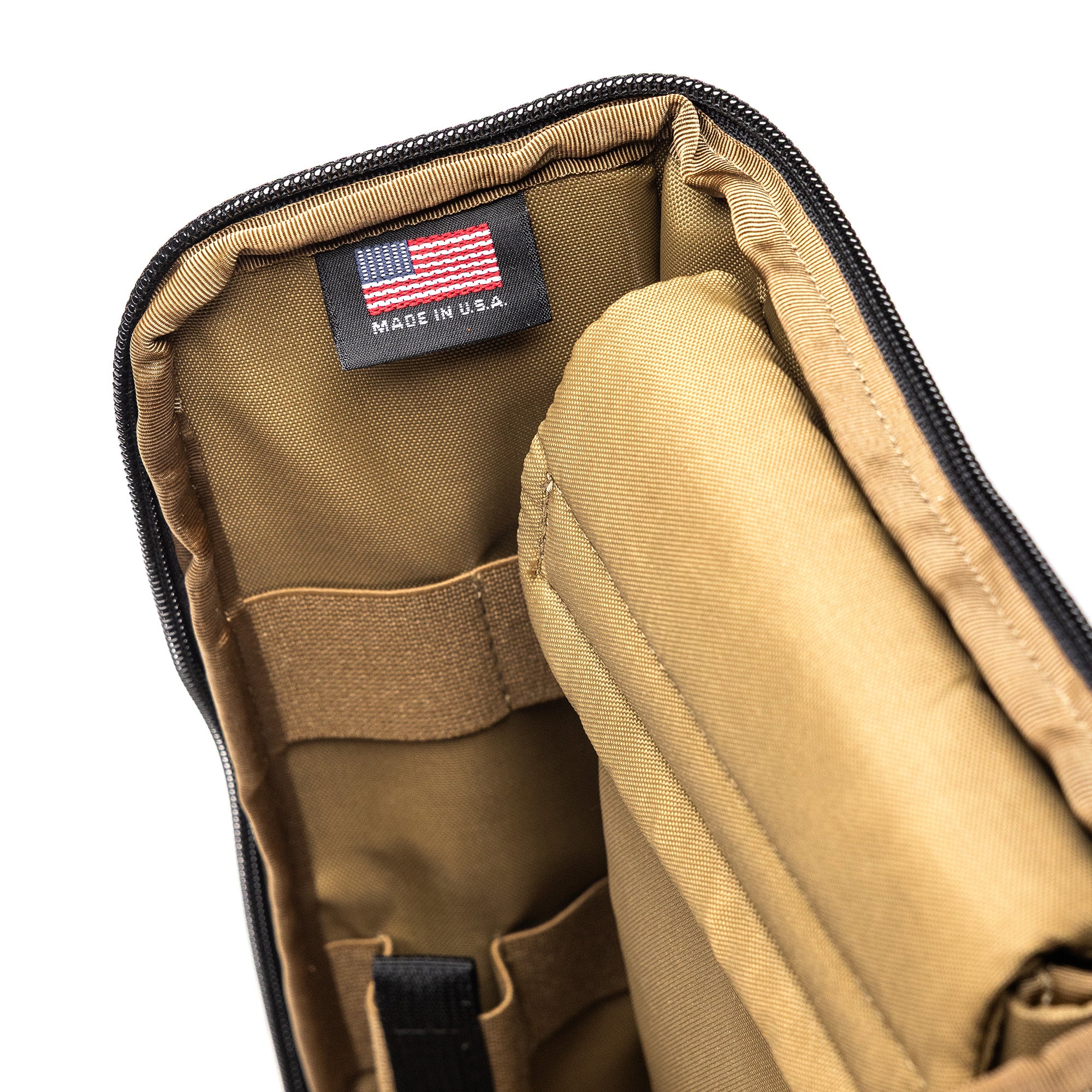 Inside view of the Lone Star 2 Pistol Bag with tan interior, multiple compartments, and a US-made label.