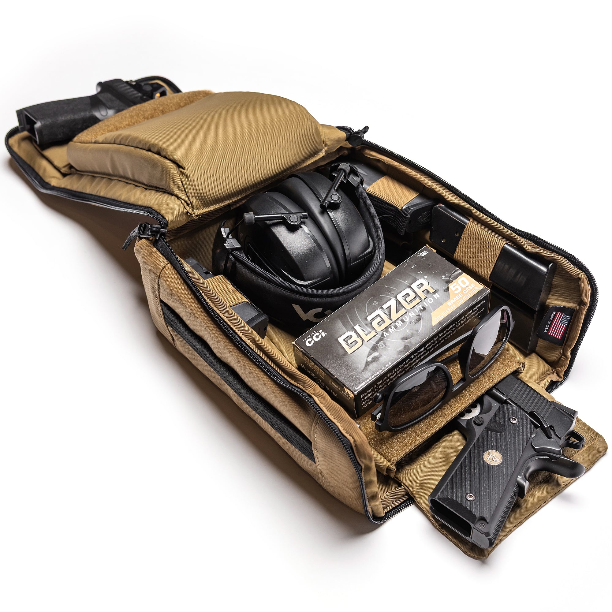 Open Lone Star 2 Pistol Bag with two handguns, ear protection, sunglasses, ammunition box, and accessories inside.