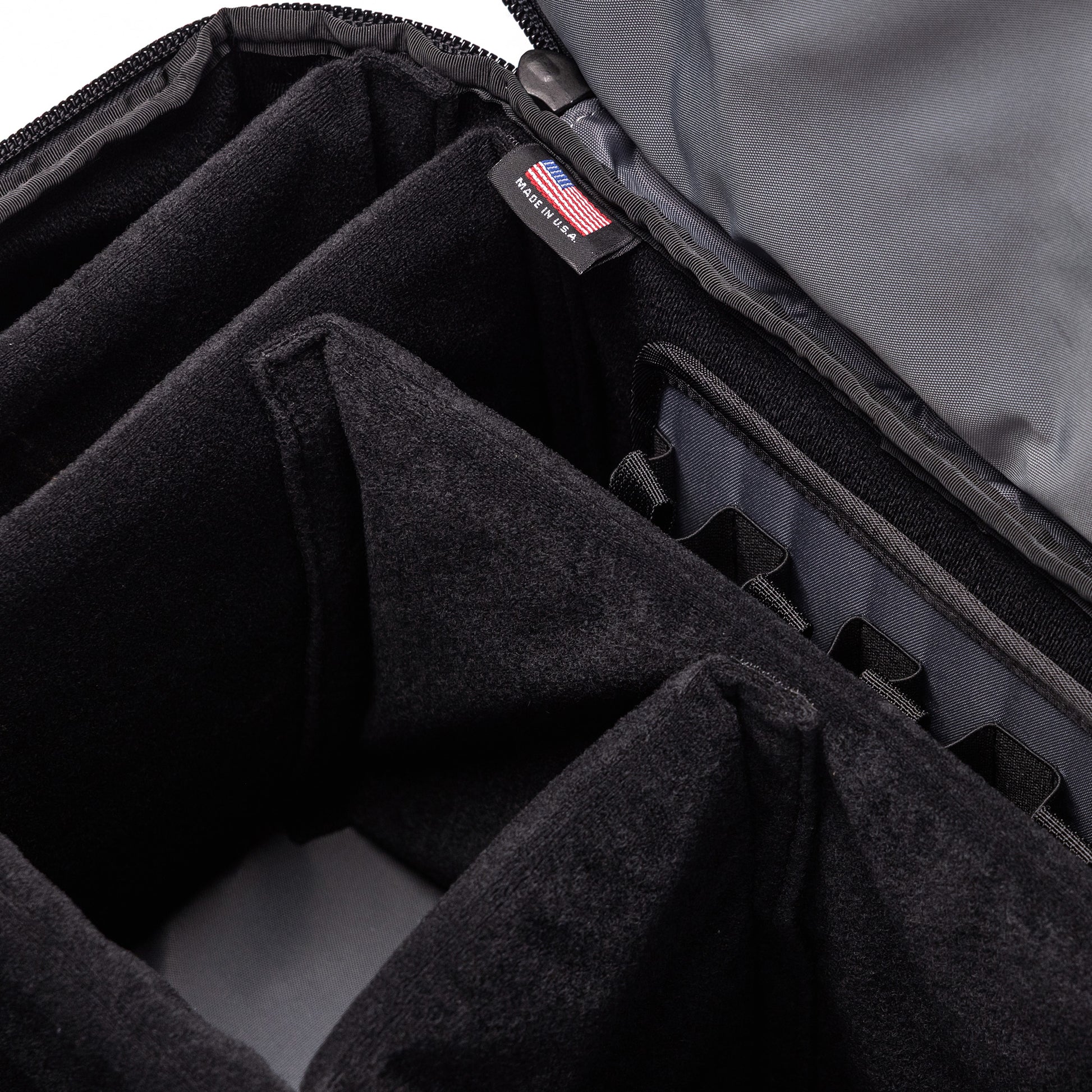 Interior view of the Lone Star Range Bag showing padded compartments for organized storage of firearms and accessories.