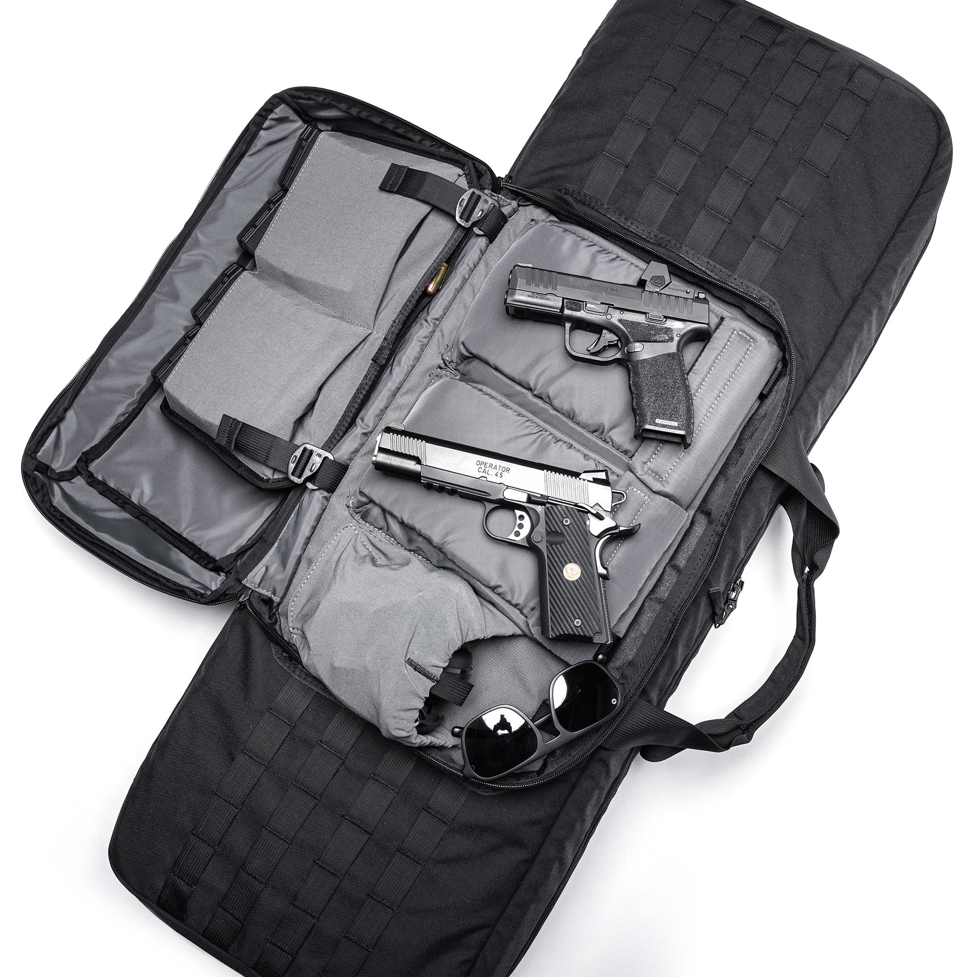 Open black Lone Star 36" rifle bag with padded compartments holding two handguns, sunglasses, and ammunition.