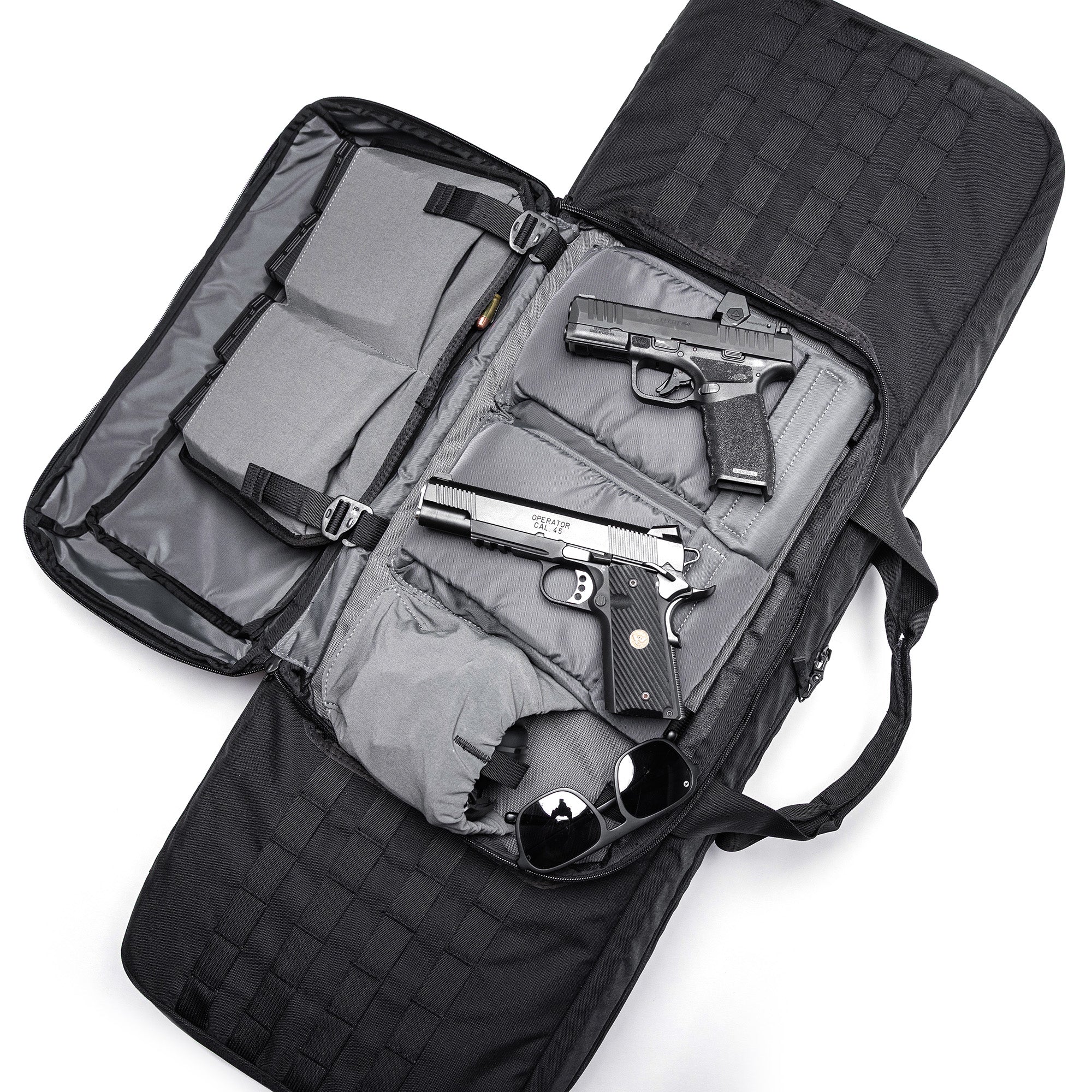 Open black Lone Star 36" rifle bag with padded compartments holding two handguns, sunglasses, and ammunition.