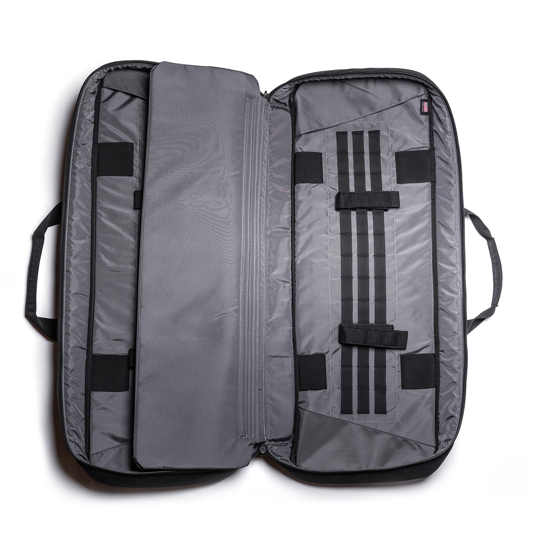 Open gray Lone Star 36" rifle bag with multiple compartments, straps, and padded interior for firearm storage.